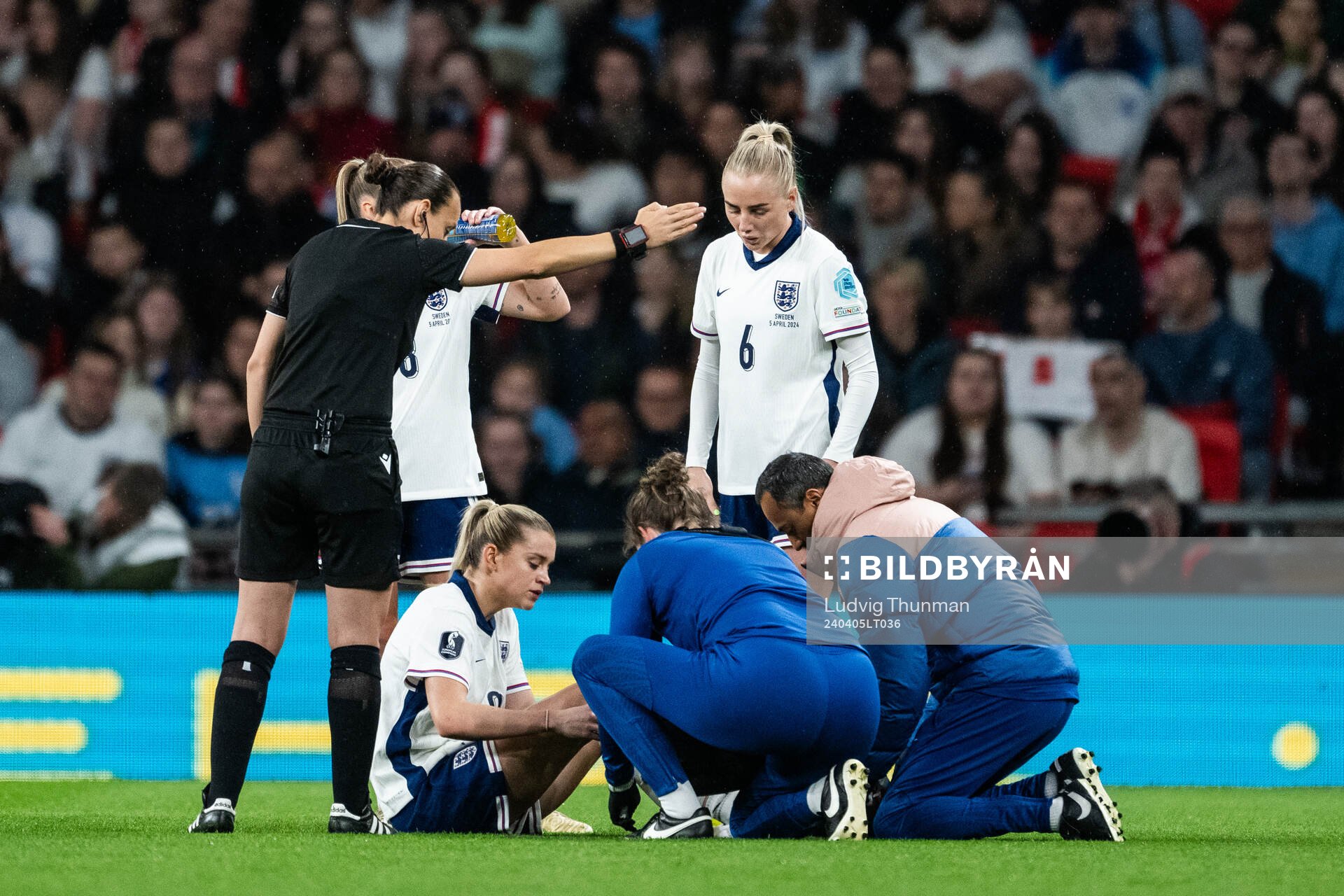 Keira Walsh of England receives medical attention