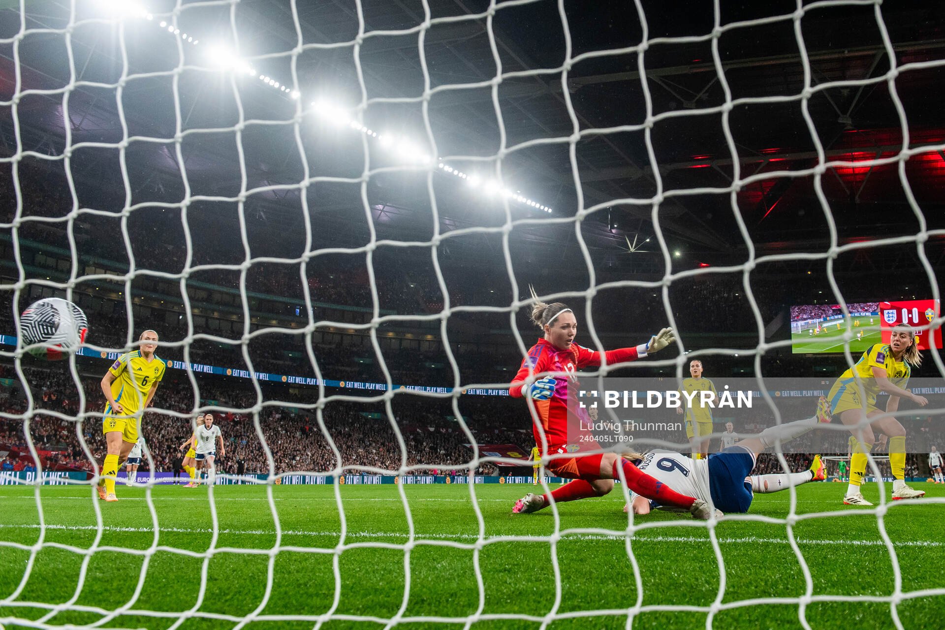 Alessia Russo of England scores 1-0 behind goalkeeper Jennifer Falk of Sweden during the UEFA Women's Euro Qualifier football match between England and Sweden on April 5, 2024 in London.