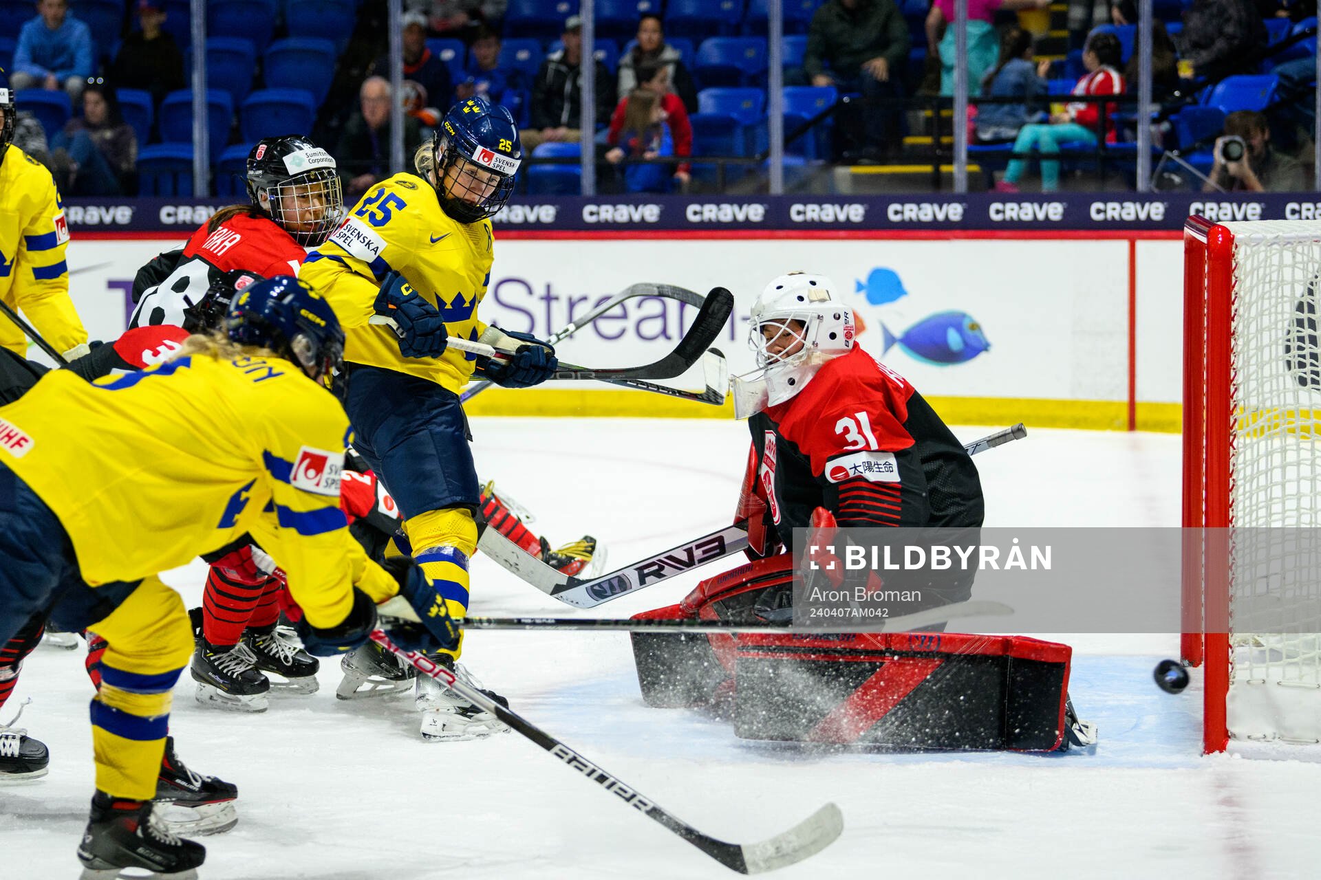 Lina Ljungblom of Sweden and goaltender Riko Kawaguchi of