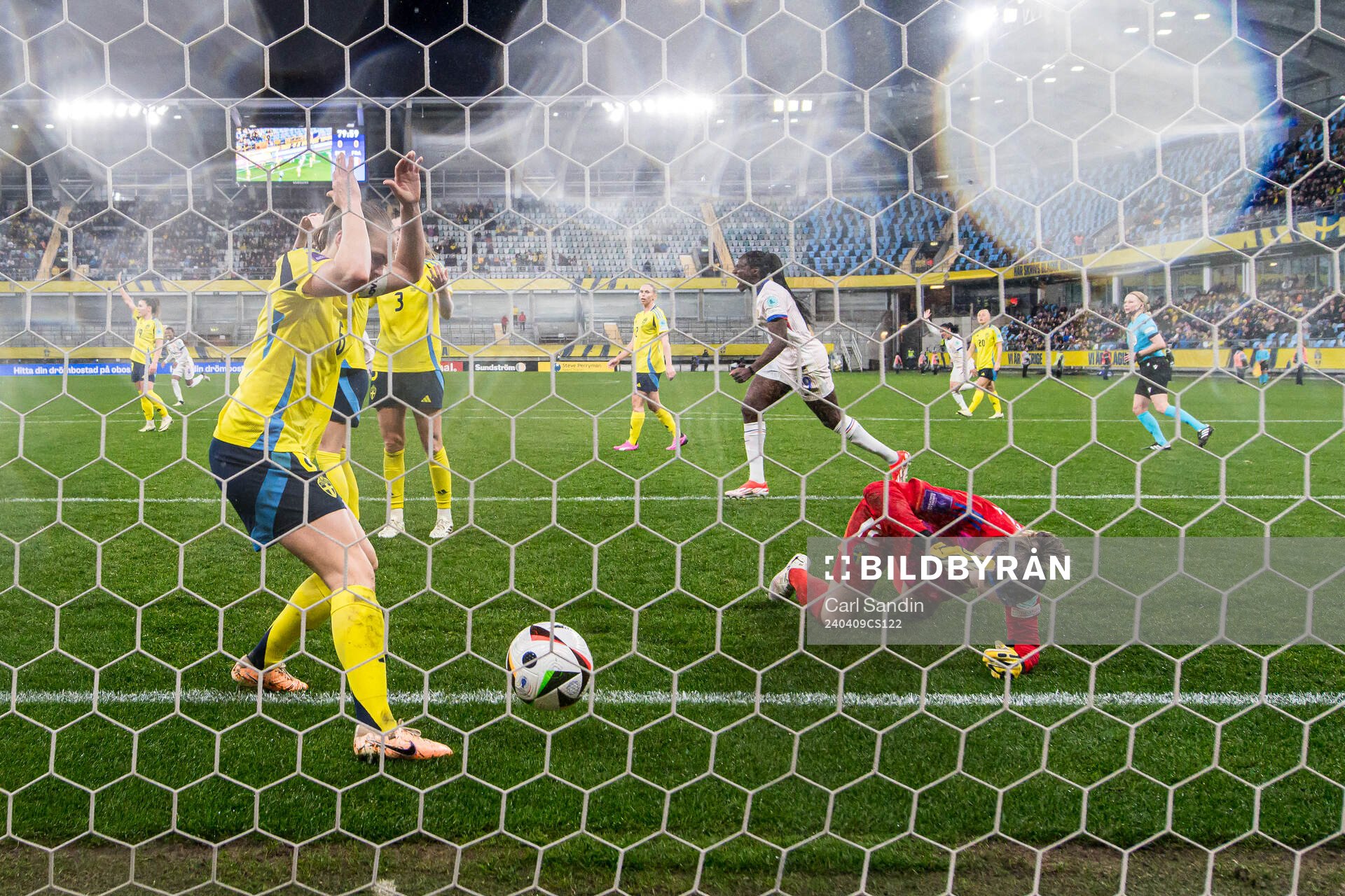Magdalena Eriksson and goalkeeper Jennifer Falk of Sweden