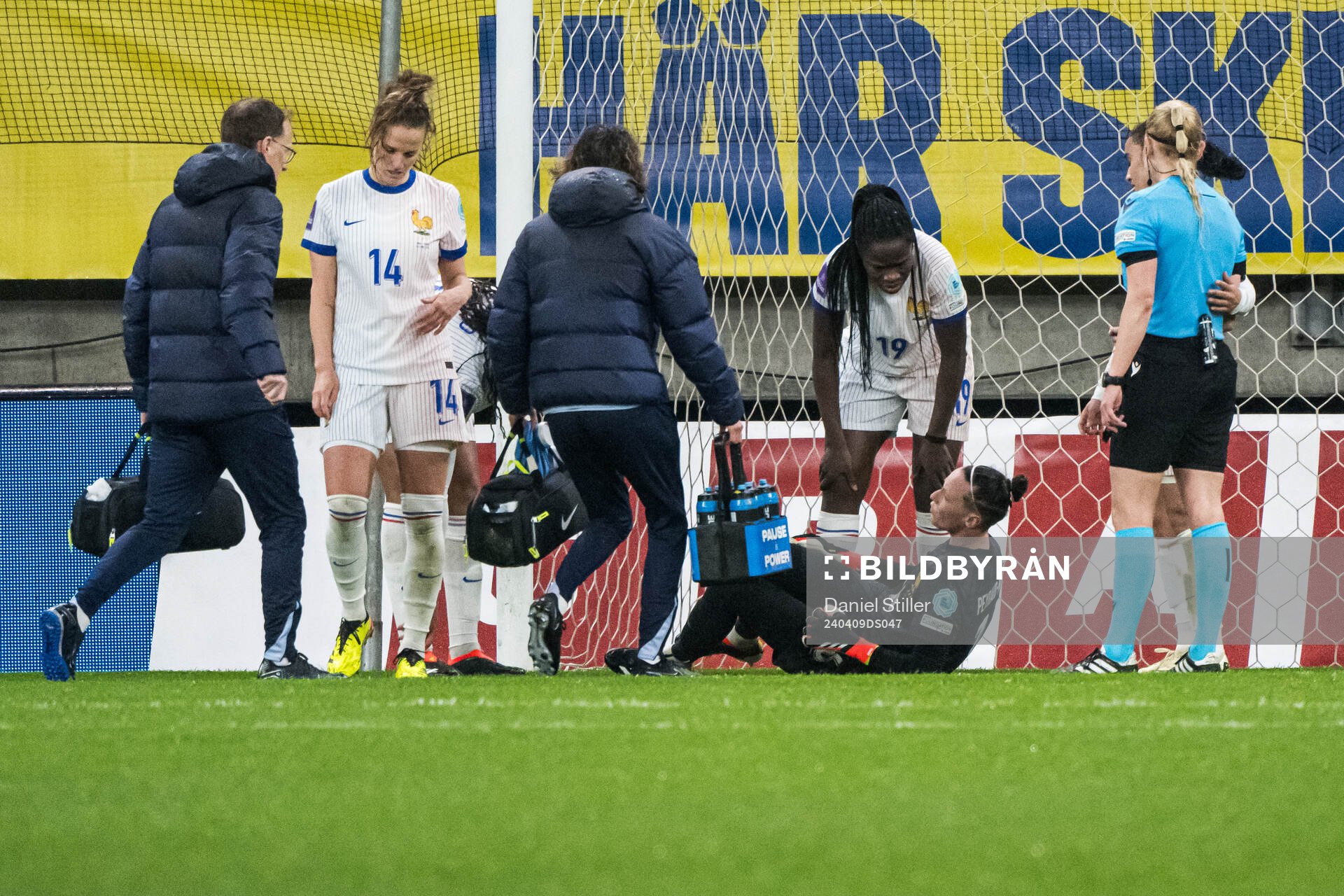 goalkeeper Pauline Peyraud-Magnin of France in pain