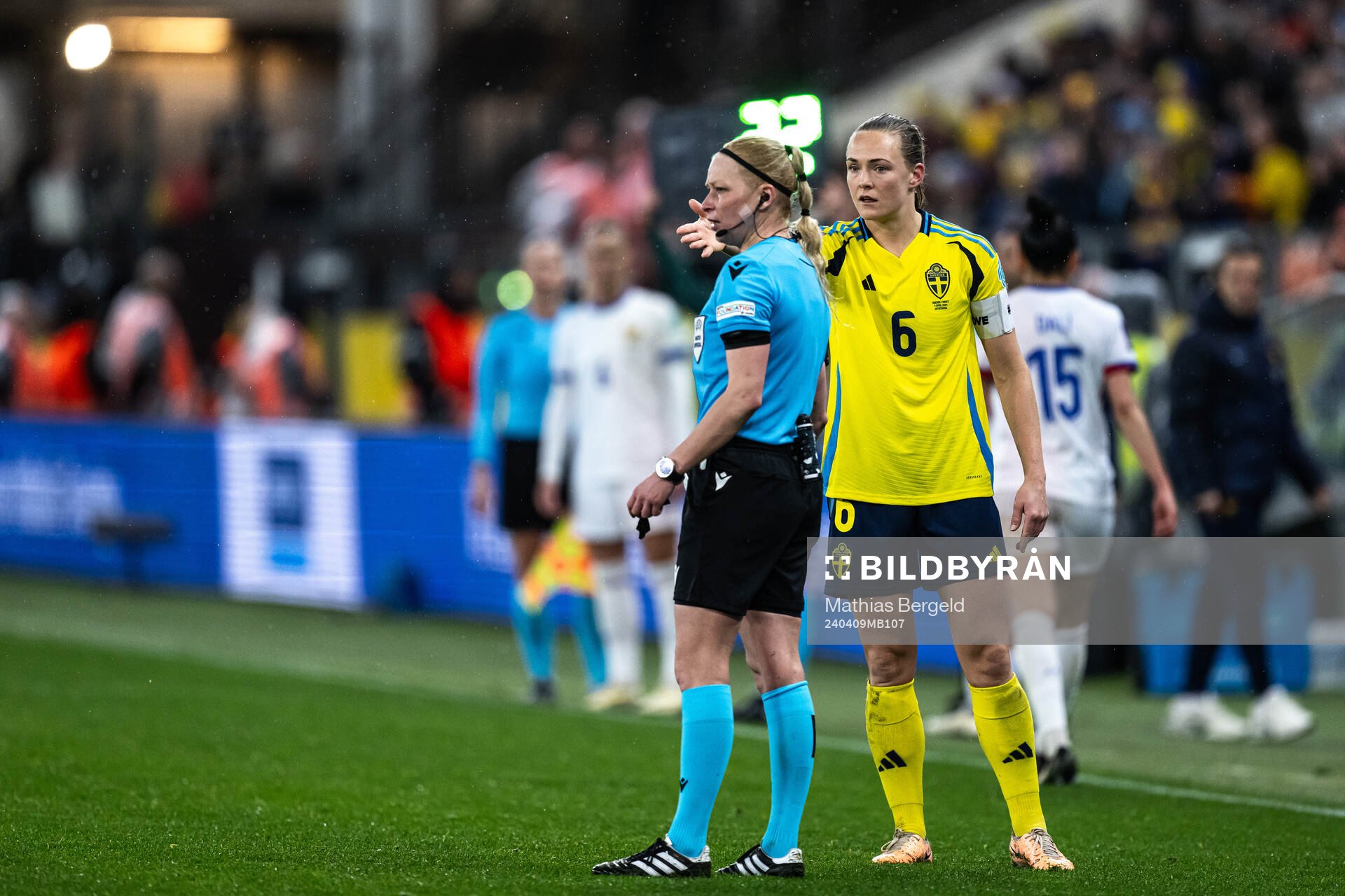 Referee Ewa Augustyn and Magdalena Eriksson of Sweden