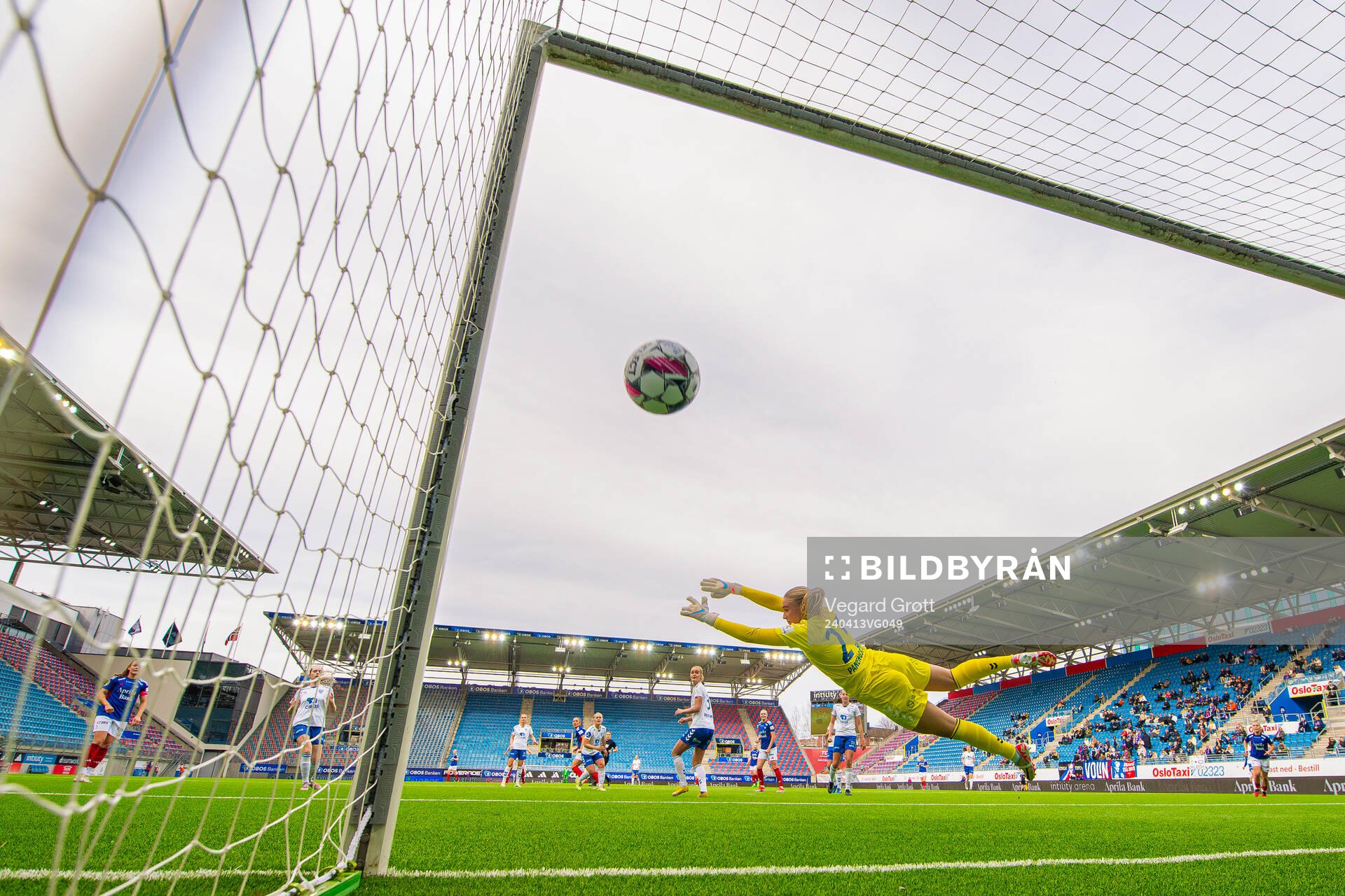 Tilde Lindwall of Vålerenga scores the 3-0 goal behind goalkeeper Selma Panengstuen of Kolbotn during the Toppserien football match between Vålerenga and Kolbotn on April 13, 2024 in Oslo.