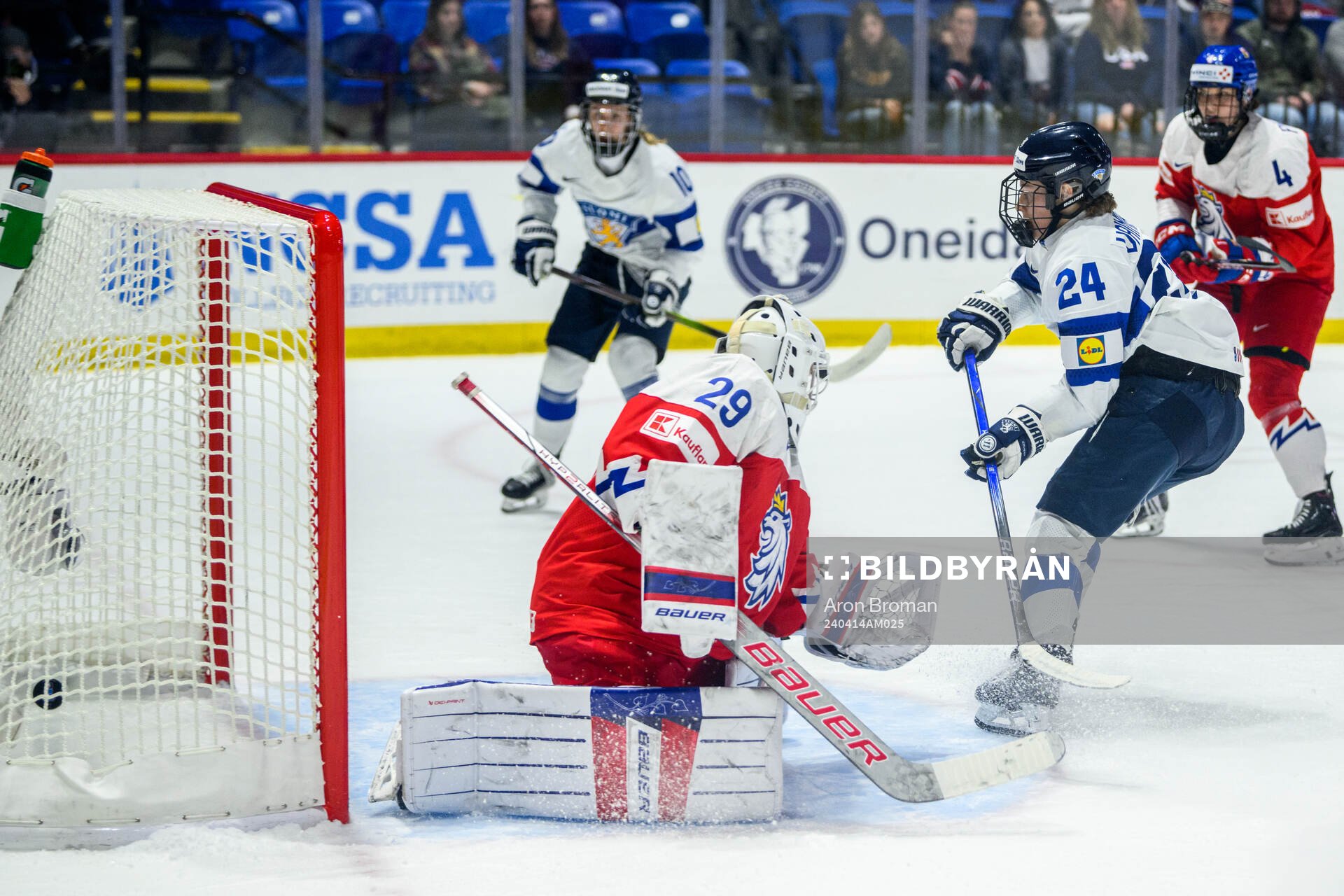 Viivi Vainikka of Finland scores 1-2 behind goaltender