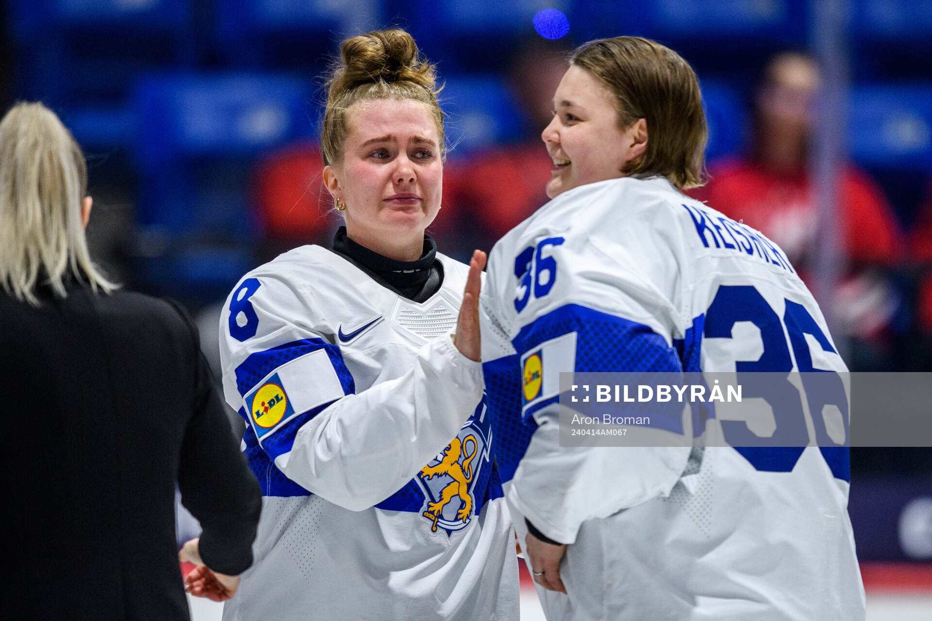 Eve Savander and goaltender Anni Keisala of Finland