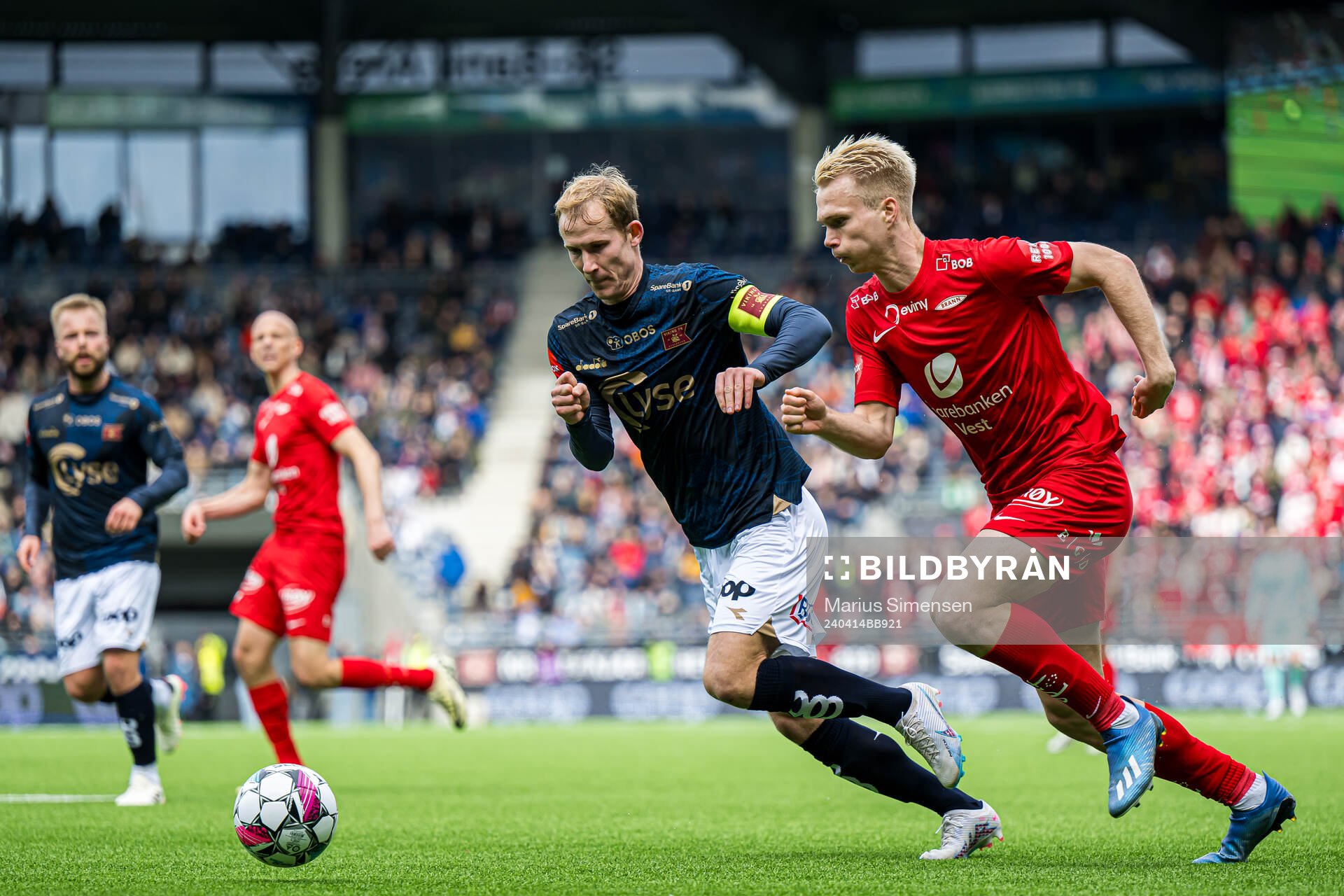 Viljar Helland Vevatne of Viking and Magnus Warming of Brann during the Eliteserien match between Viking and Brann on April 14, 2024 in Stavanger.