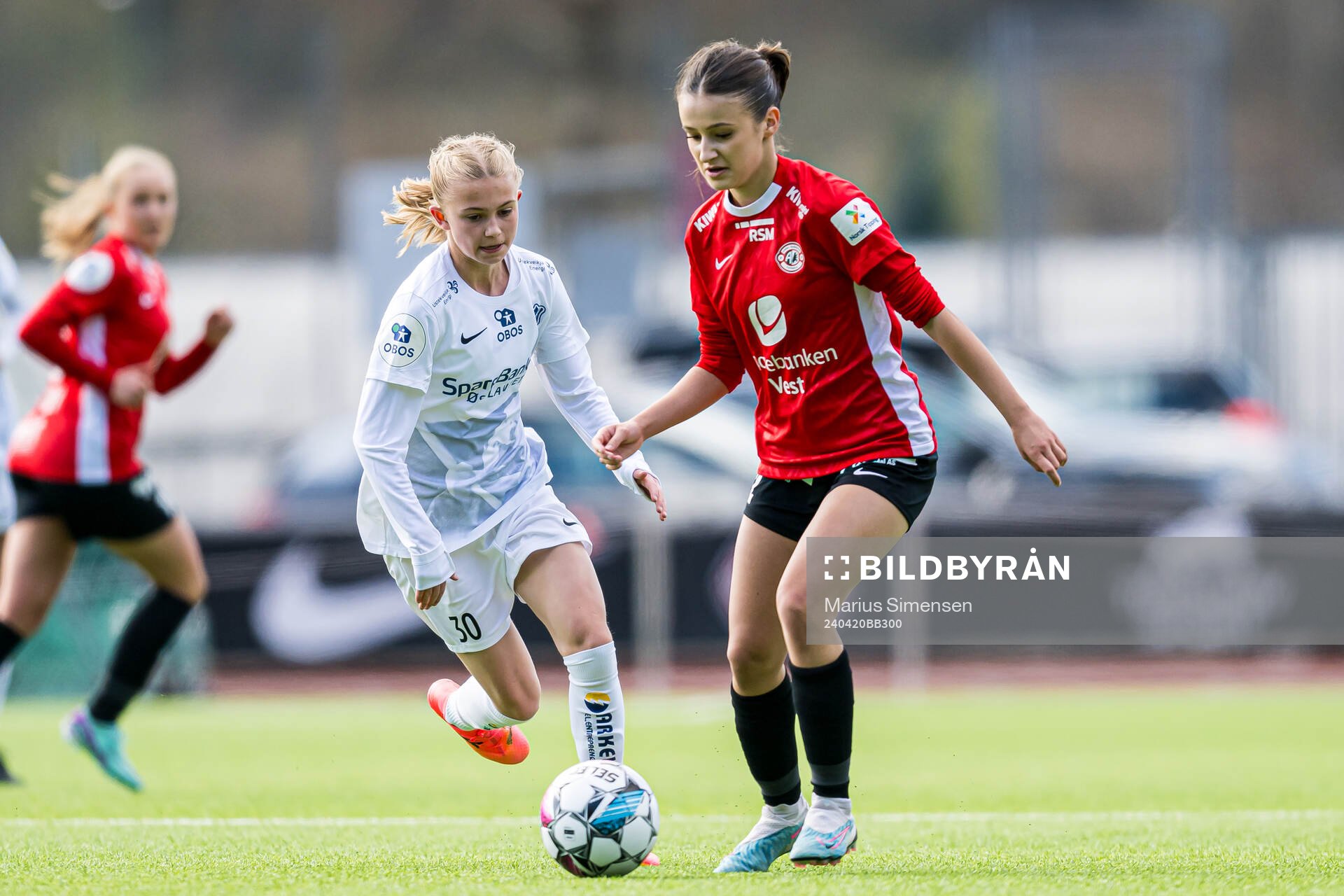 Elida Holvik Kolbjørnsen of Stabæk and Samra Muhic of Arna-Bjørnar during the Toppserien football match between Arna-Bjørnar and Stabæk on April 20, 2024 in Bergen.