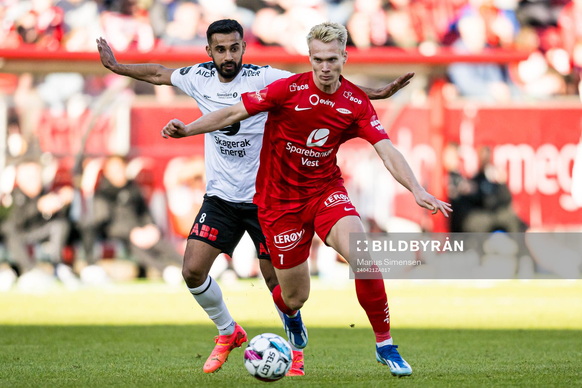 Etzaz Hussain of Odd and Magnus Warming of Brann during the Eliteserien match between Brann and Odd on April 21, 2024 in Bergen. 