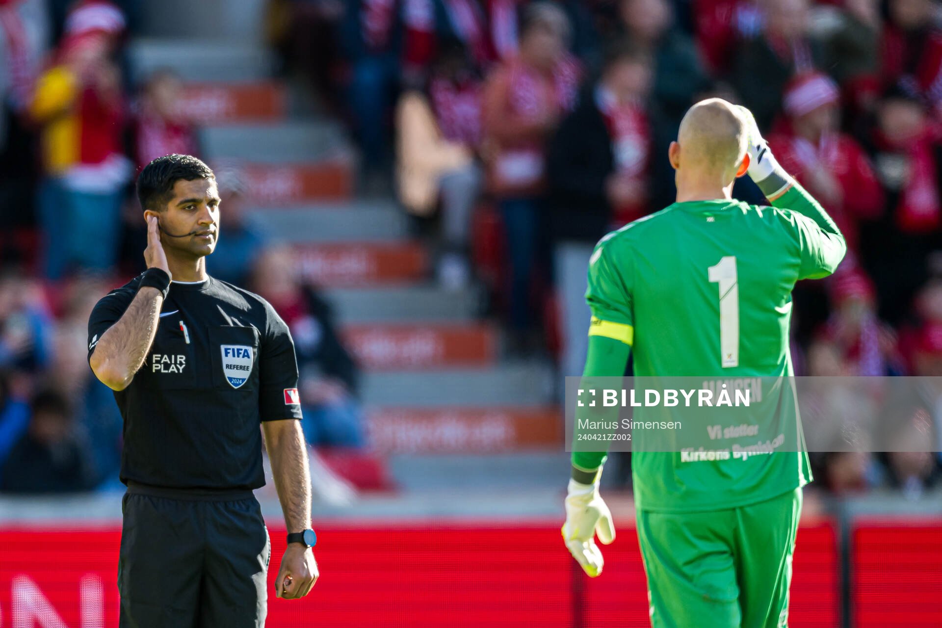 Mohammad Usman Aslam, referee, and Andre Hansen of Odd during a video assistant referee (VAR) check during the Eliteserien match between Brann and Odd on April 21, 2024 in Bergen. 