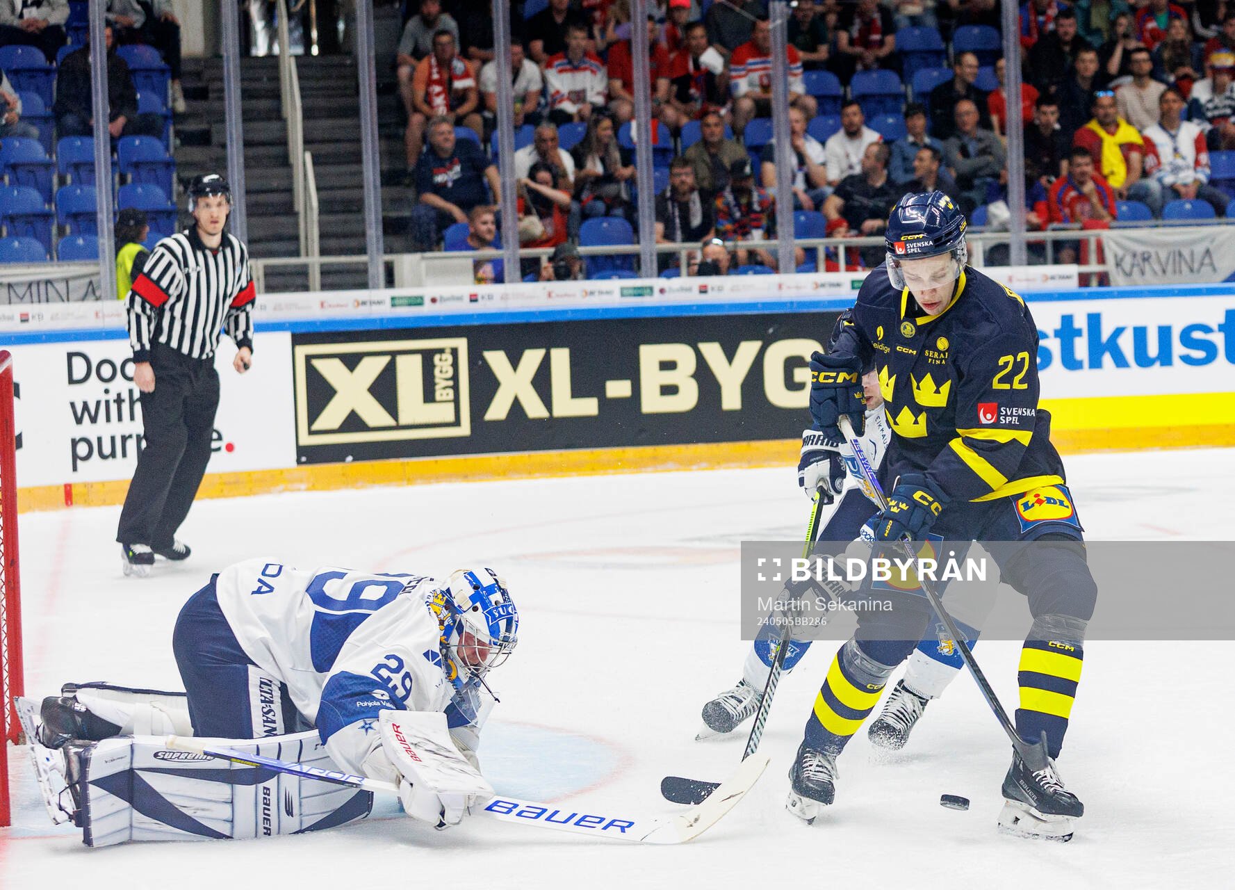 Lukas Vejdemo of Sweden against goaltender Harri Säteri of