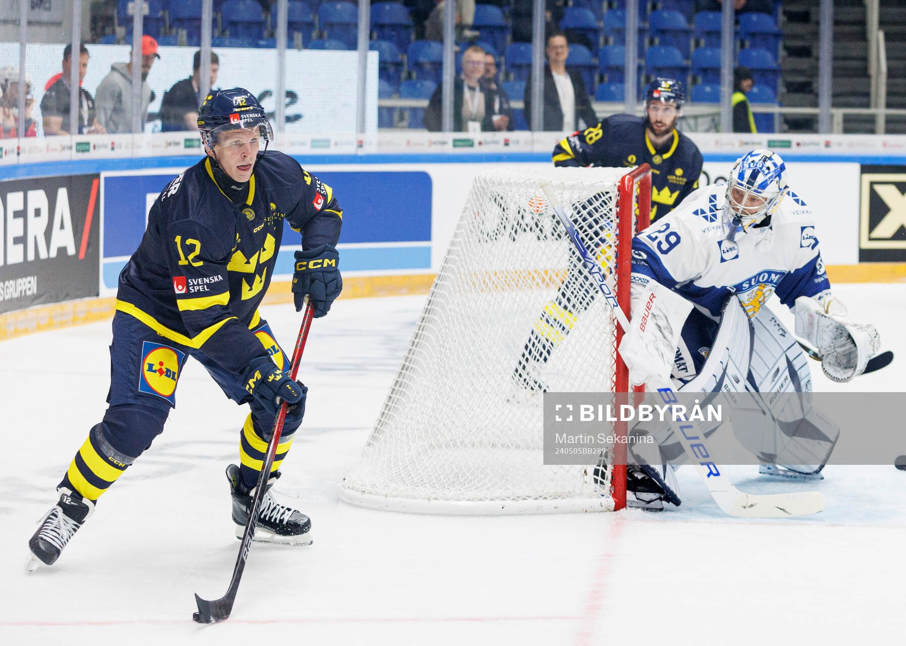 Max Friberg of Sweden and goaltender Harri Säteri of