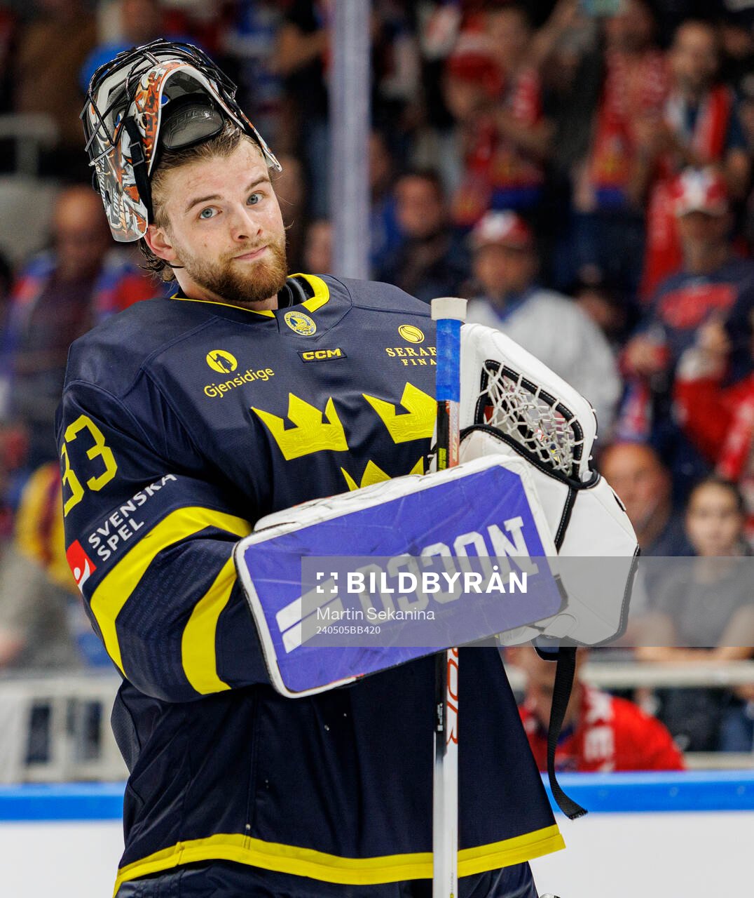 Goaltender Samuel Ersson of Sweden looks dejected
