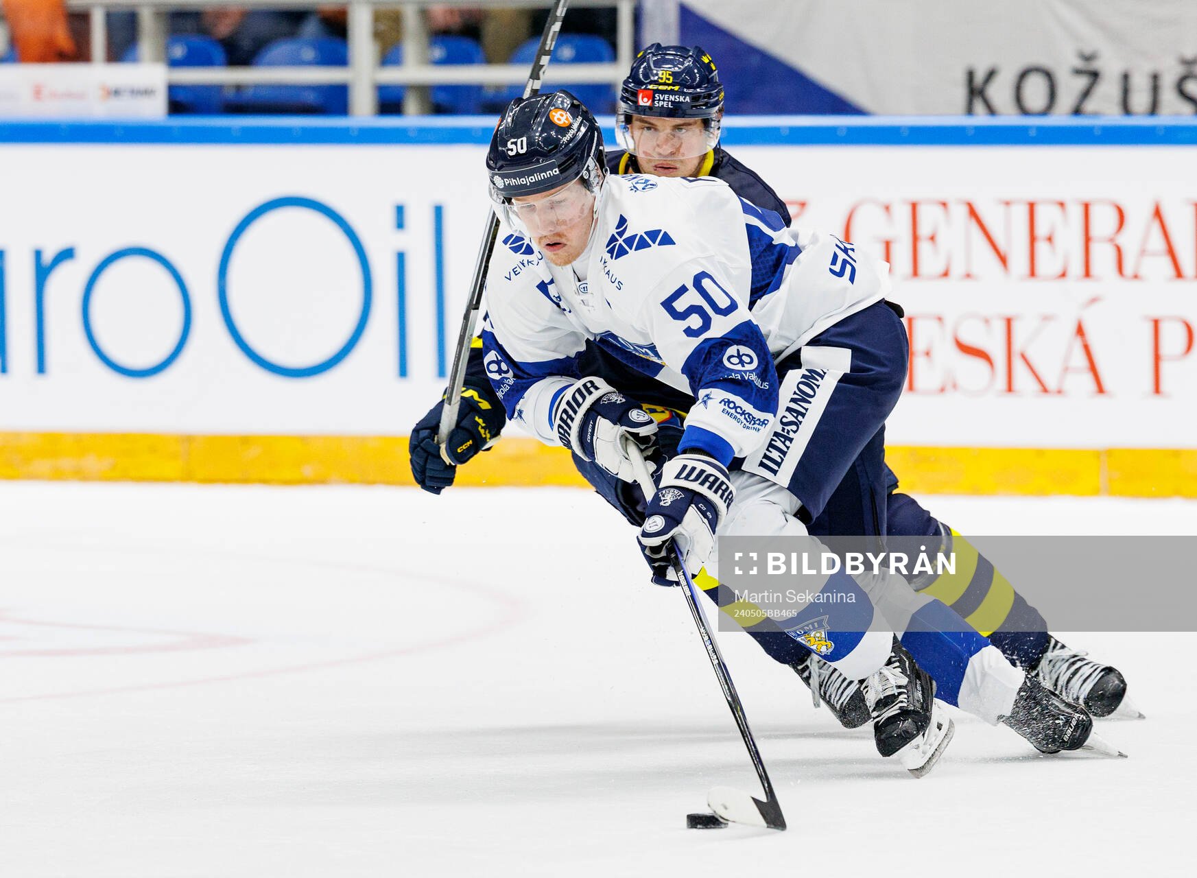 André Burakovsky of Sweden and Juuso Riikola of Finland