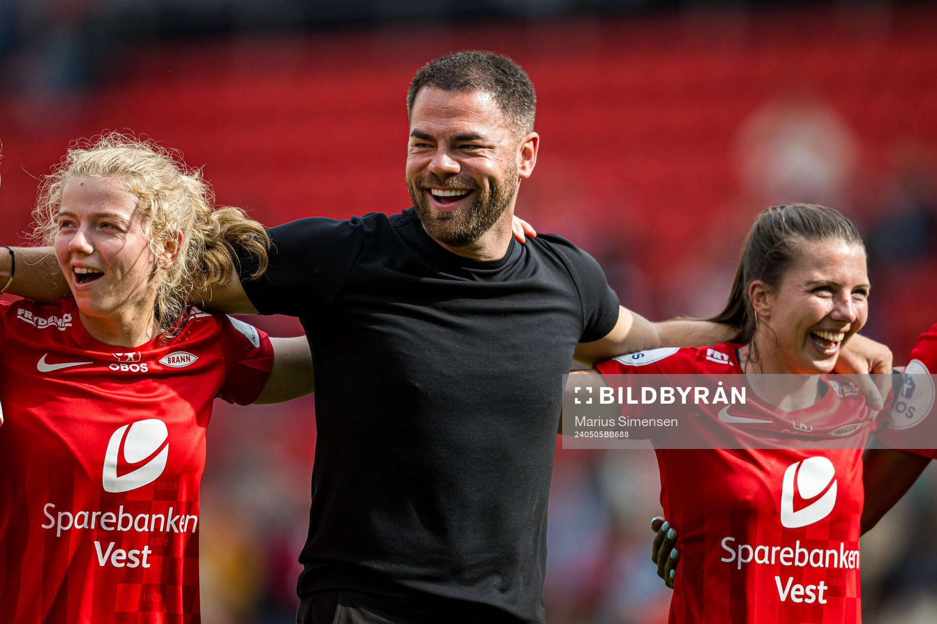 Justine Kielland, Martin Ho, head coach of Brann, and Cecilie Redisch Kvamme of Brann celebrates after the Toppserien football match between Brann and Rosenborg on May 5, 2024 in Bergen.
