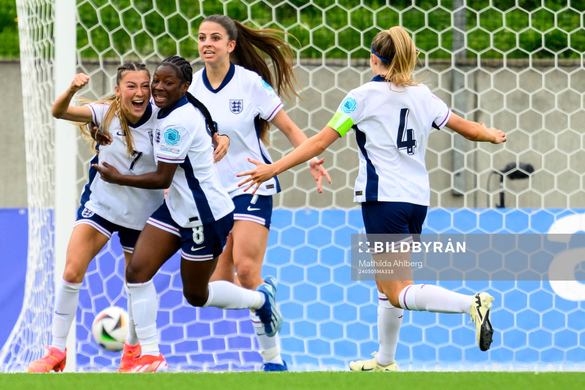 Erica Parkinson and Omotara Junaid of England celebrate