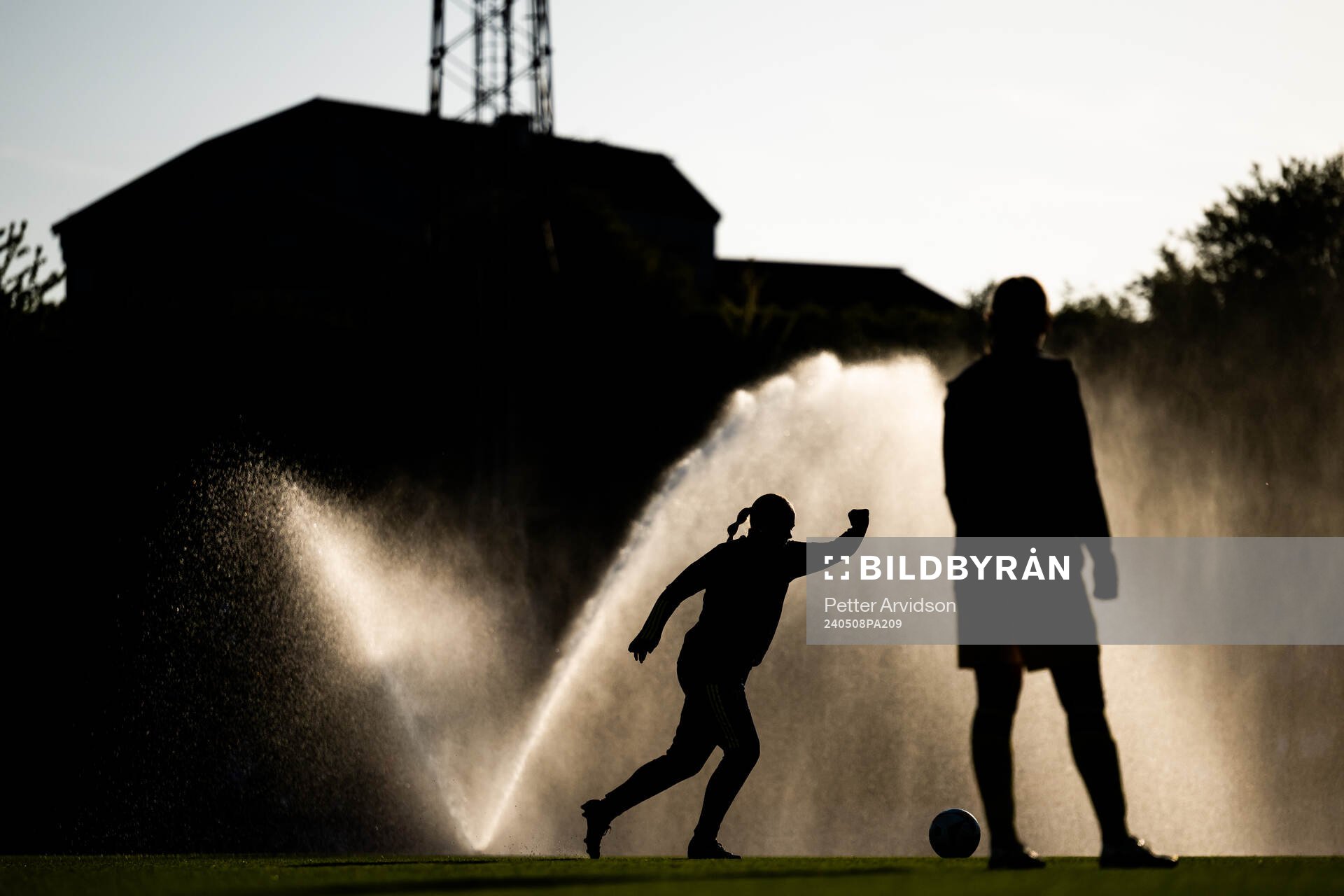 A silhouette of a player warming up