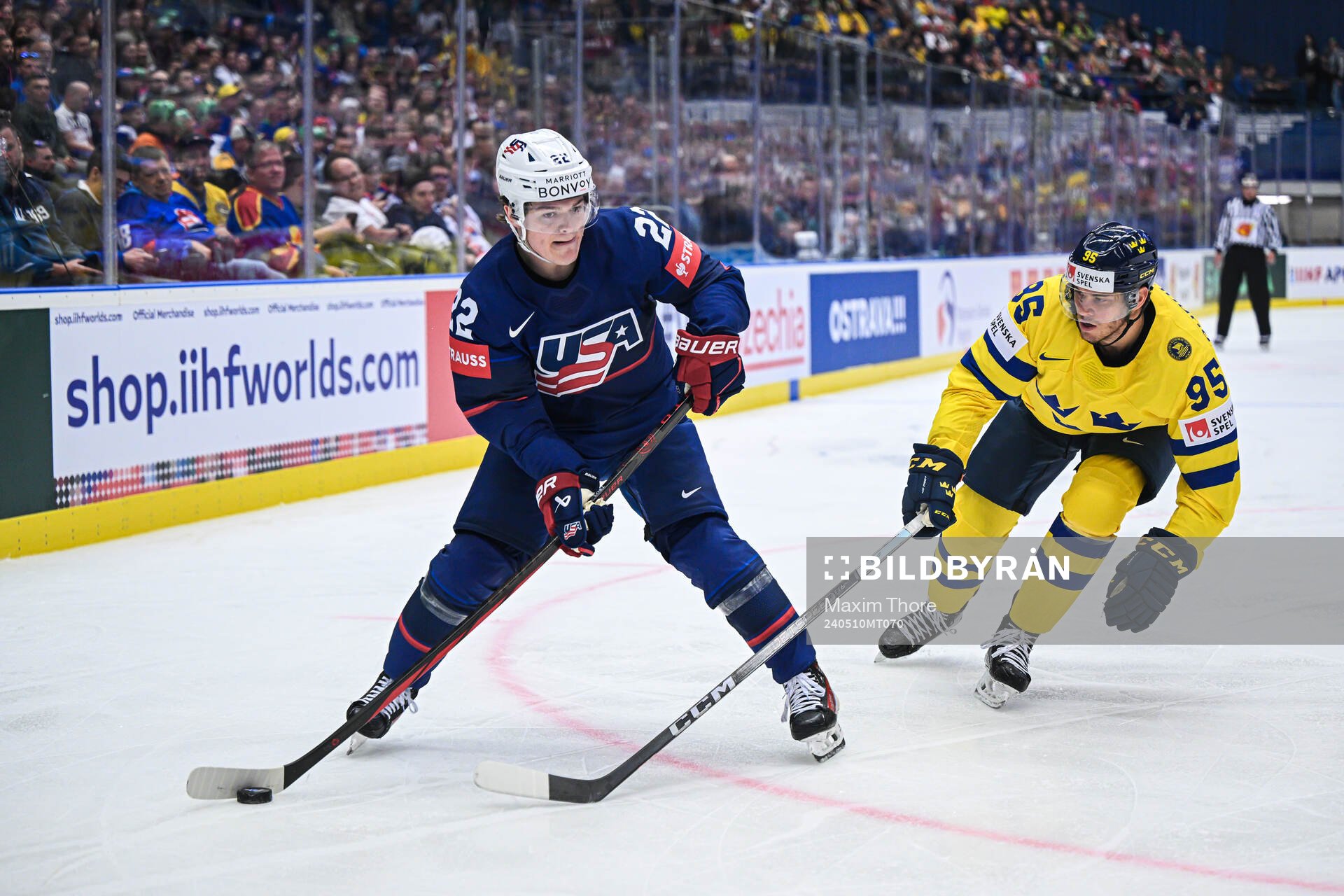 Cole Caufield of USA and André Burakovsky of Sweden