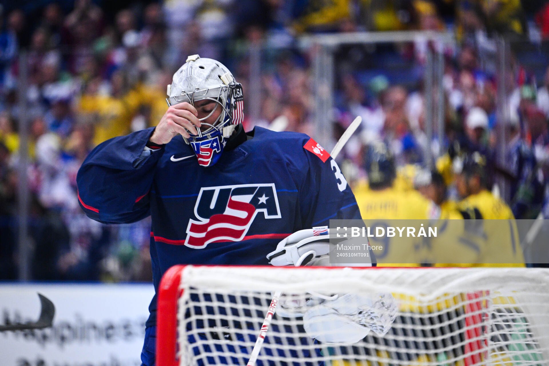 Alex Lyon of USA looks dejected
