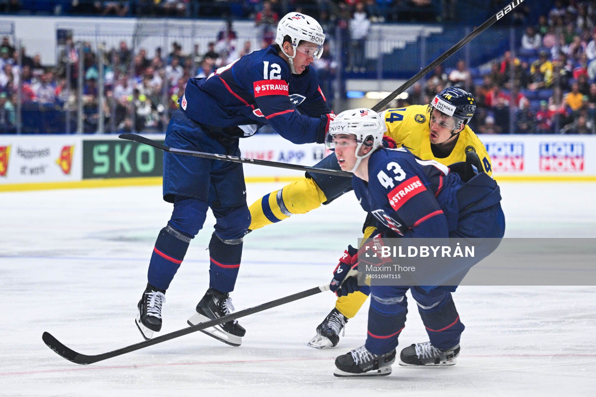 Matt Boldy of USA and Luke Huges against Joel Eriksson Ek