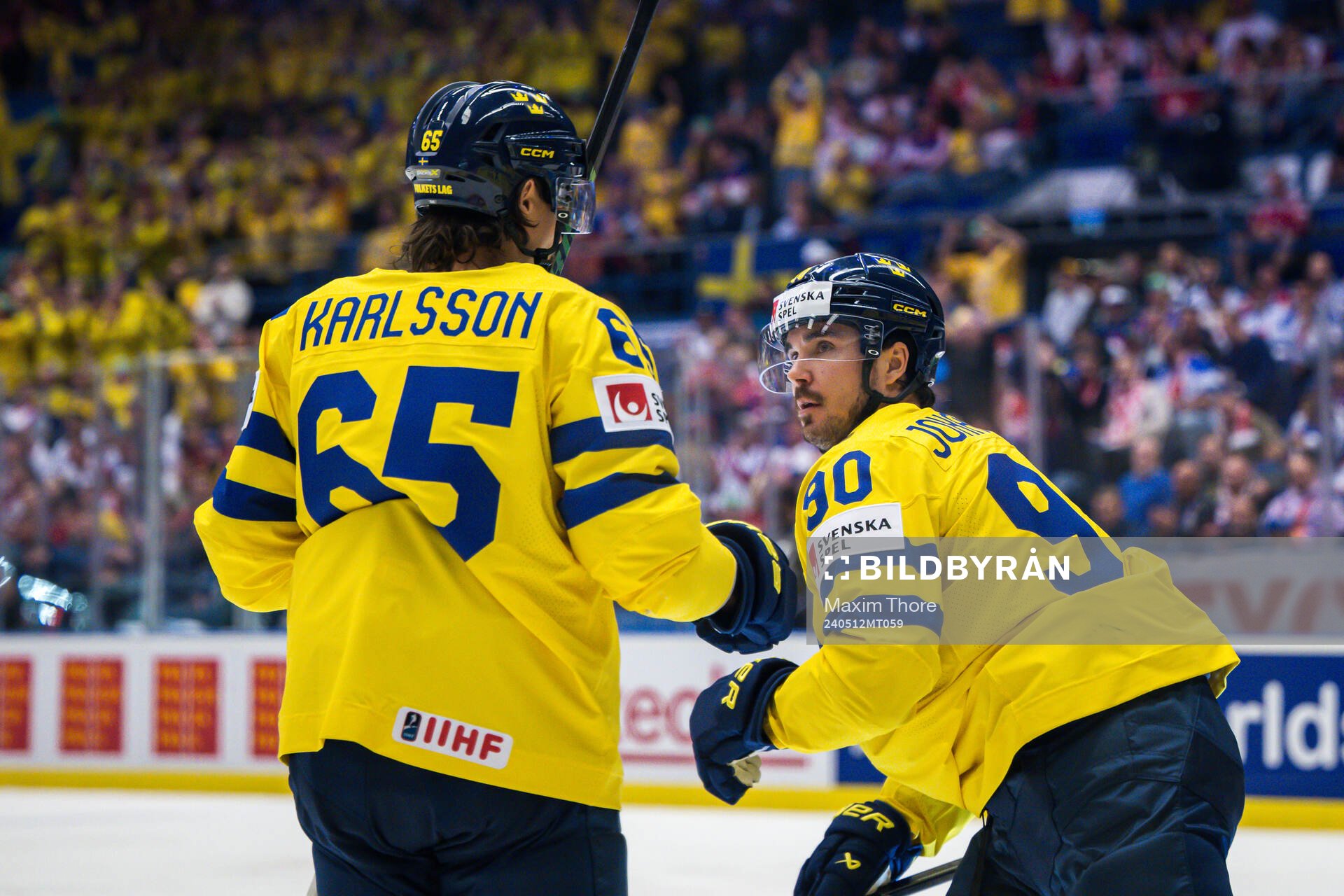 Erik Karlsson and Marcus Johansson of Sweden celebrate