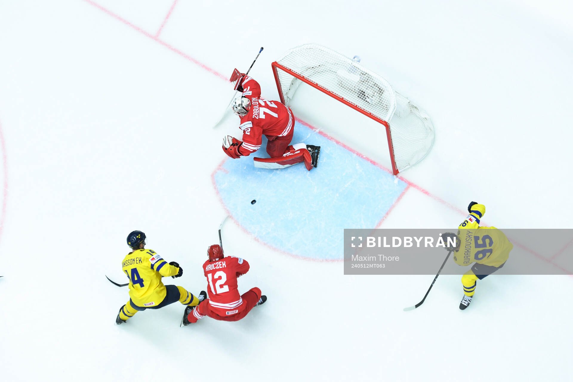 Marcus Johansson of Sweden (not pictured) scores 1-0 behind