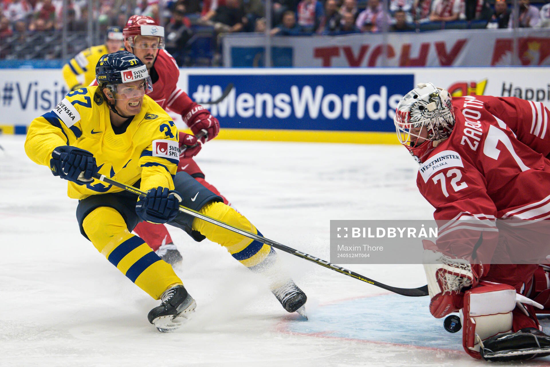 Isac Lundeström of Sweden and goaltender David Zabolotny