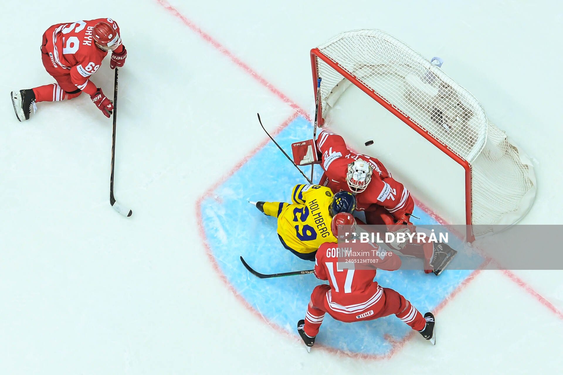 Pontus Holmberg of Sweden against goaltender David