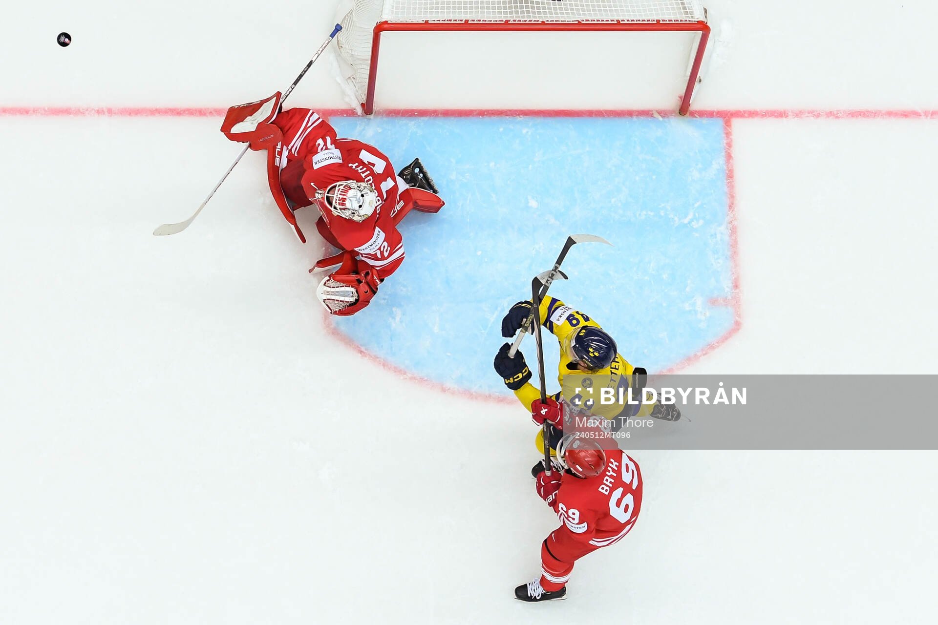 Goaltender David Zabolotny and Mateusz Bryk of Poland