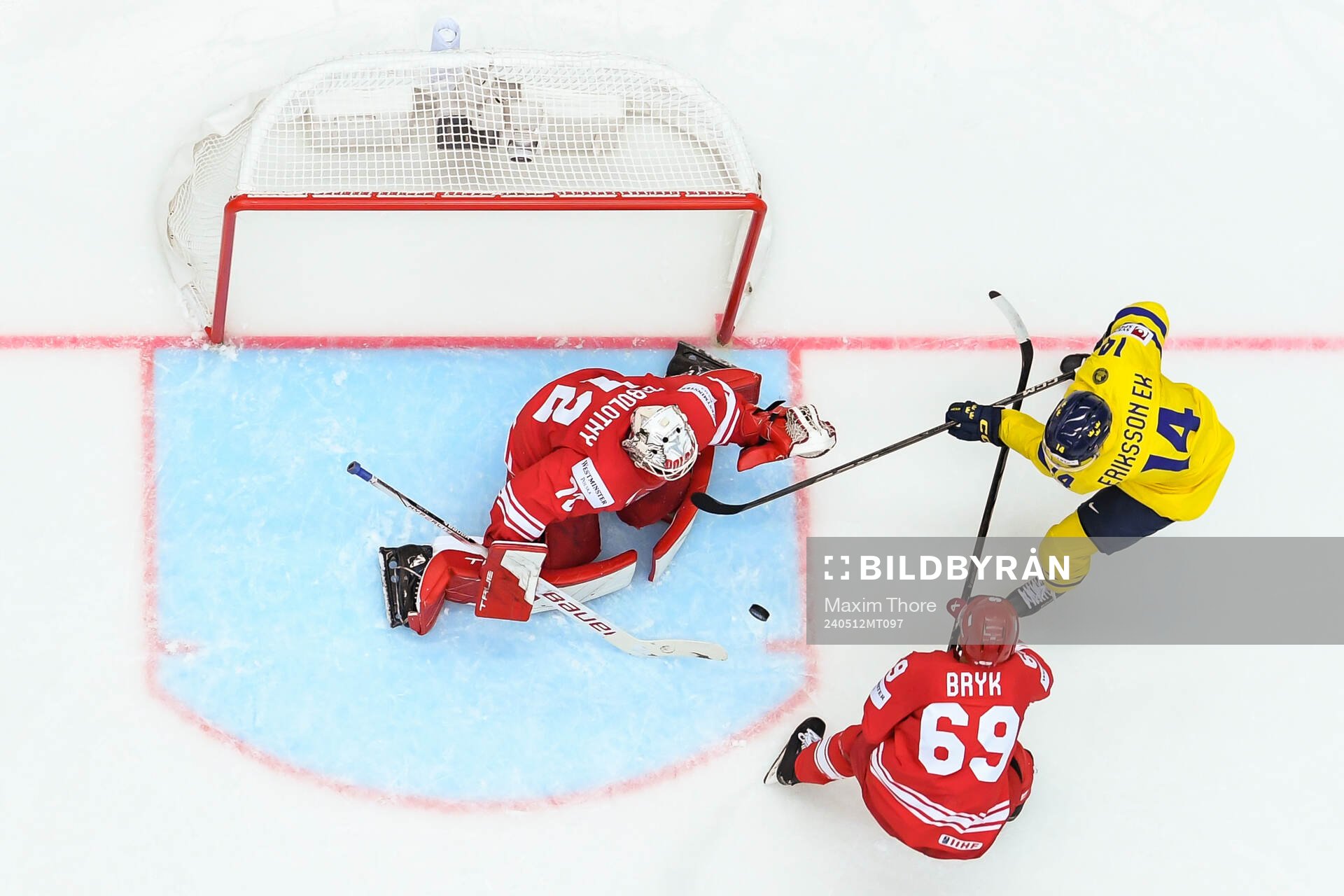 Goaltender David Zabolotny and Mateusz Bryk of Poland