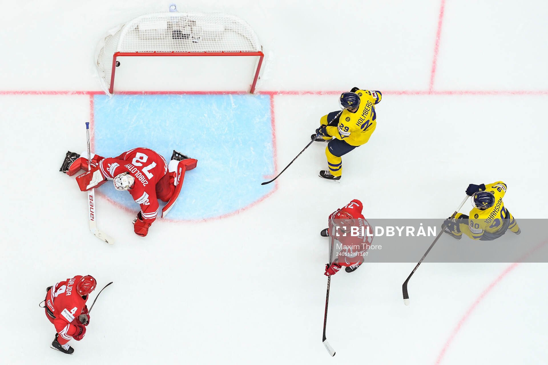 Patryk Wajda, goaltender David Zabolotny and Pawel Dronia