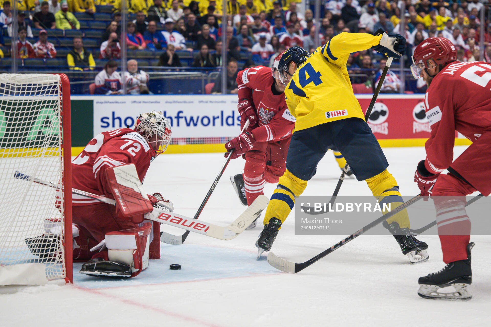 Goaltender David Zabolotny of Poland and Joel Eriksson Ek