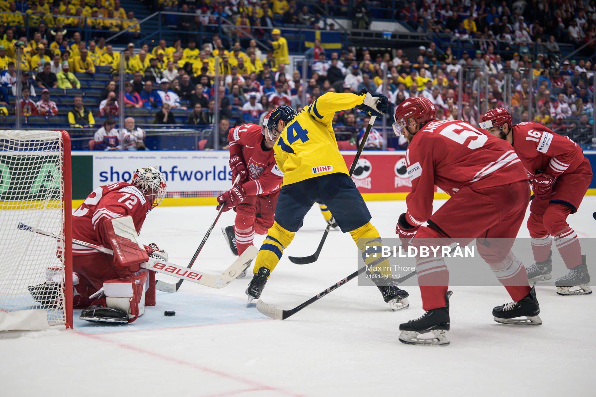 Goaltender David Zabolotny of Poland and Joel Eriksson Ek