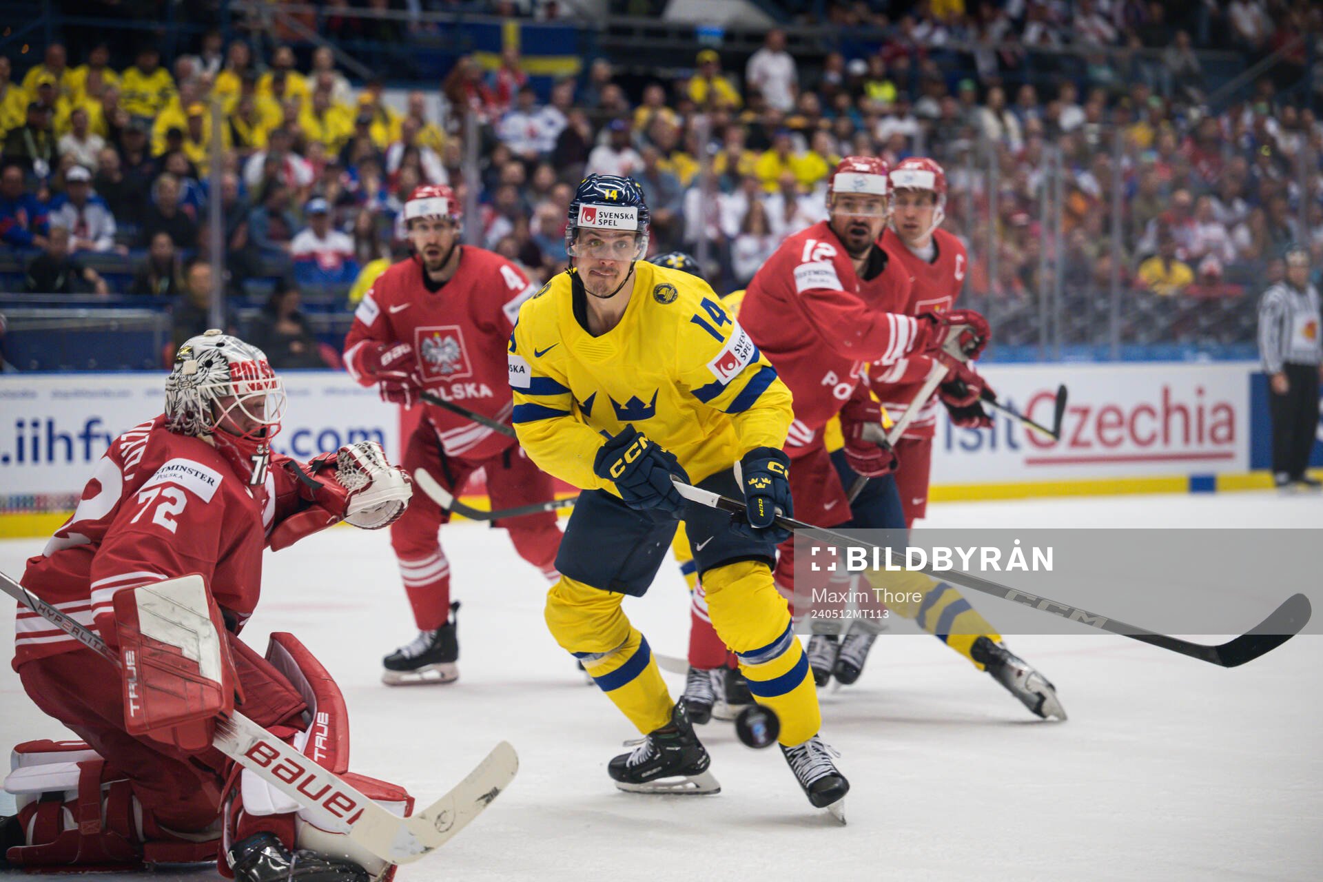 Goaltender David Zabolotny of Poland and Joel Eriksson Ek