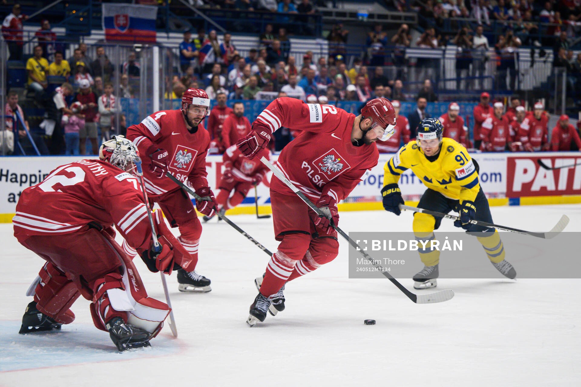 Goaltender David Zabolotny and Maciej Kruczek of Poland