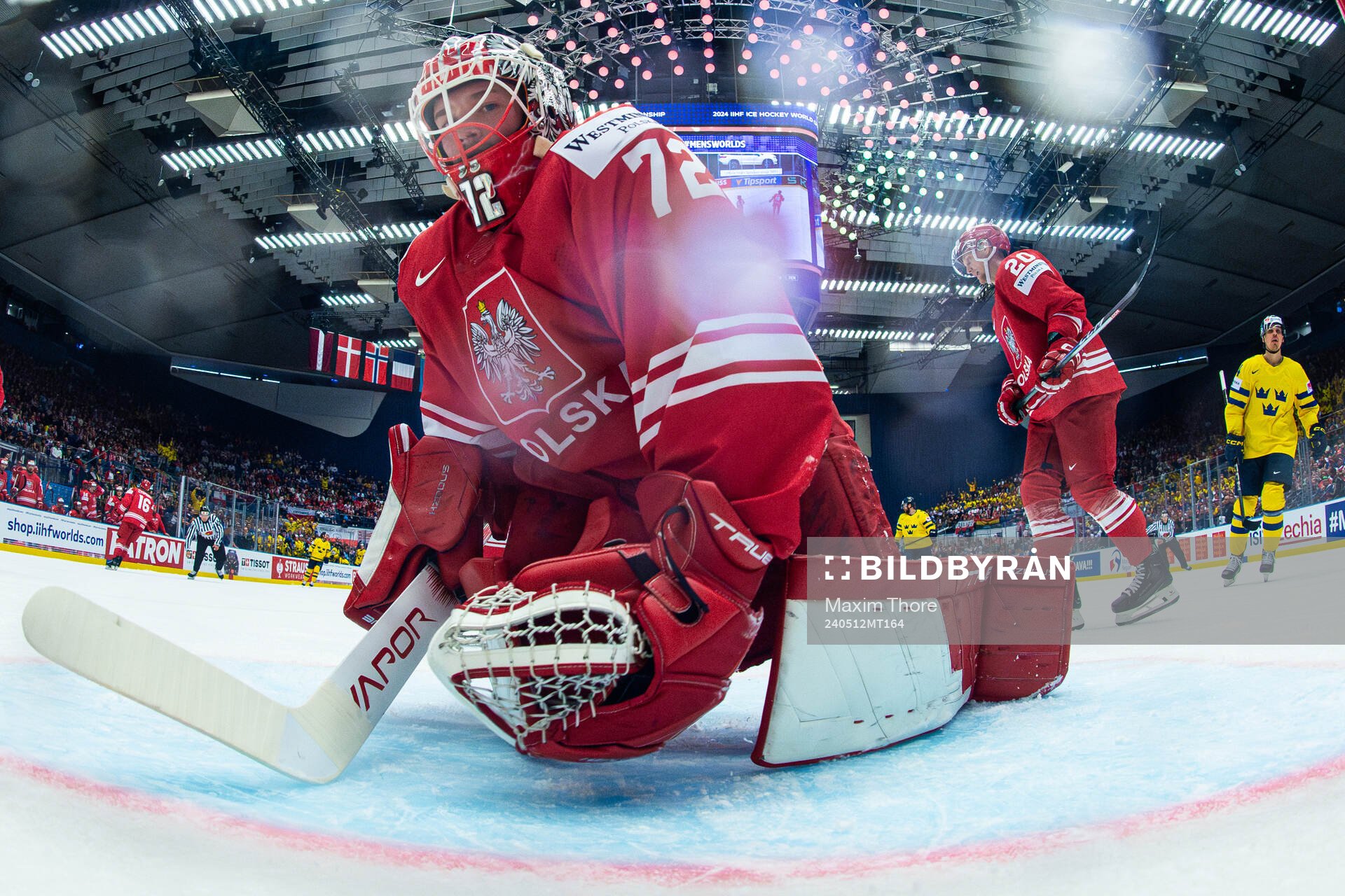 Goaltender David Zabolotny of Poland looks dejected