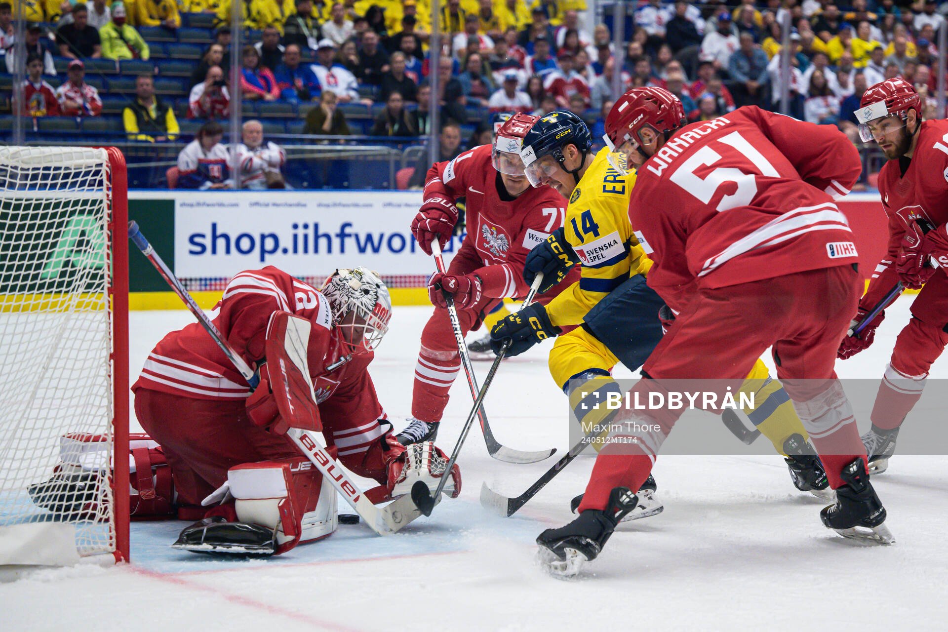 Goaltender David Zabolotny of Poland and Joel Eriksson Ek