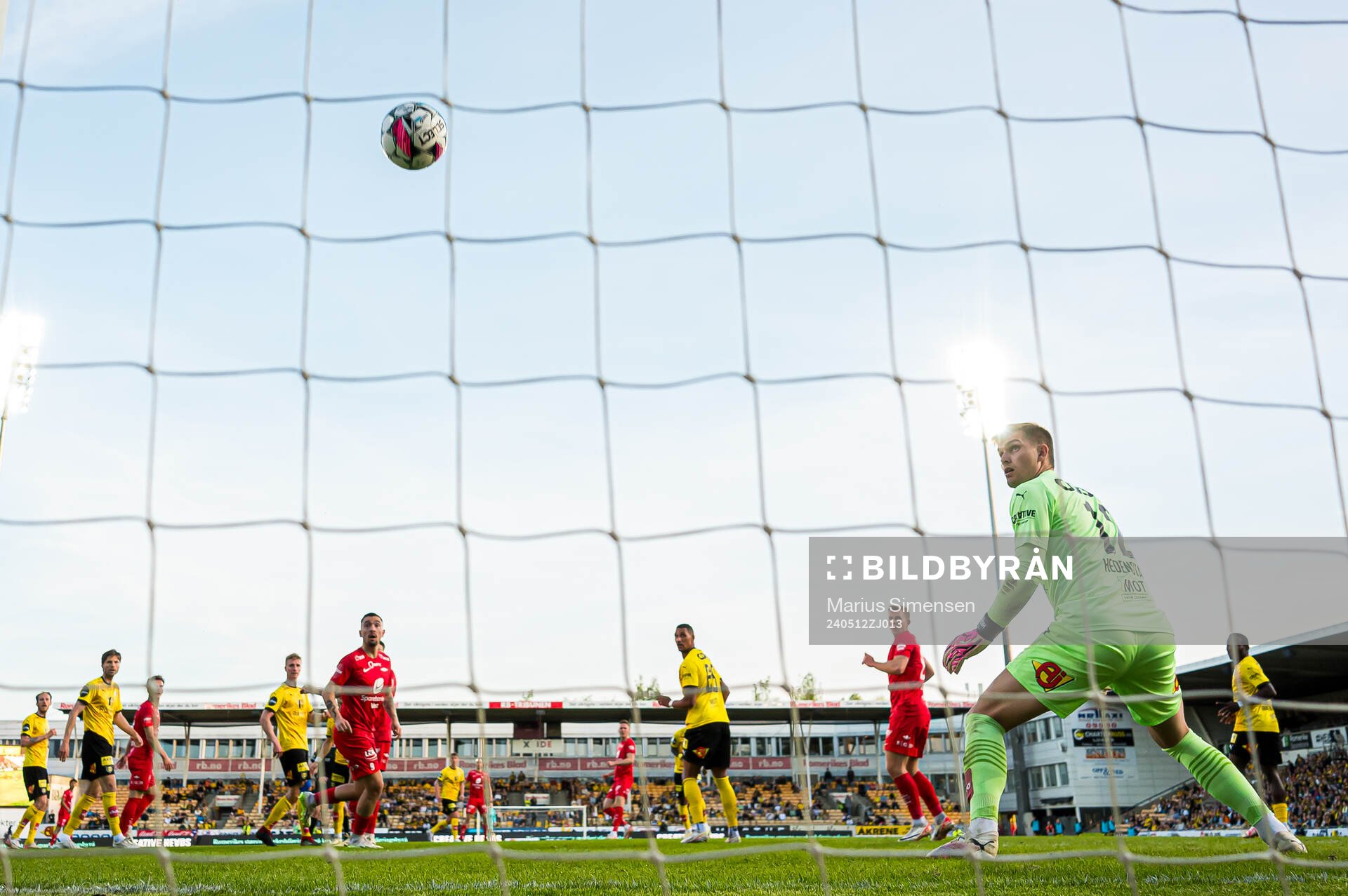 Joachim Soltvedt of Brann scores the 0-2 goal behind Mads Hedenstad Christiansen of Lillestrøm during the Eliteserien match between Lillestrøm and Brann on May 12, 2024 in Lillestrøm.