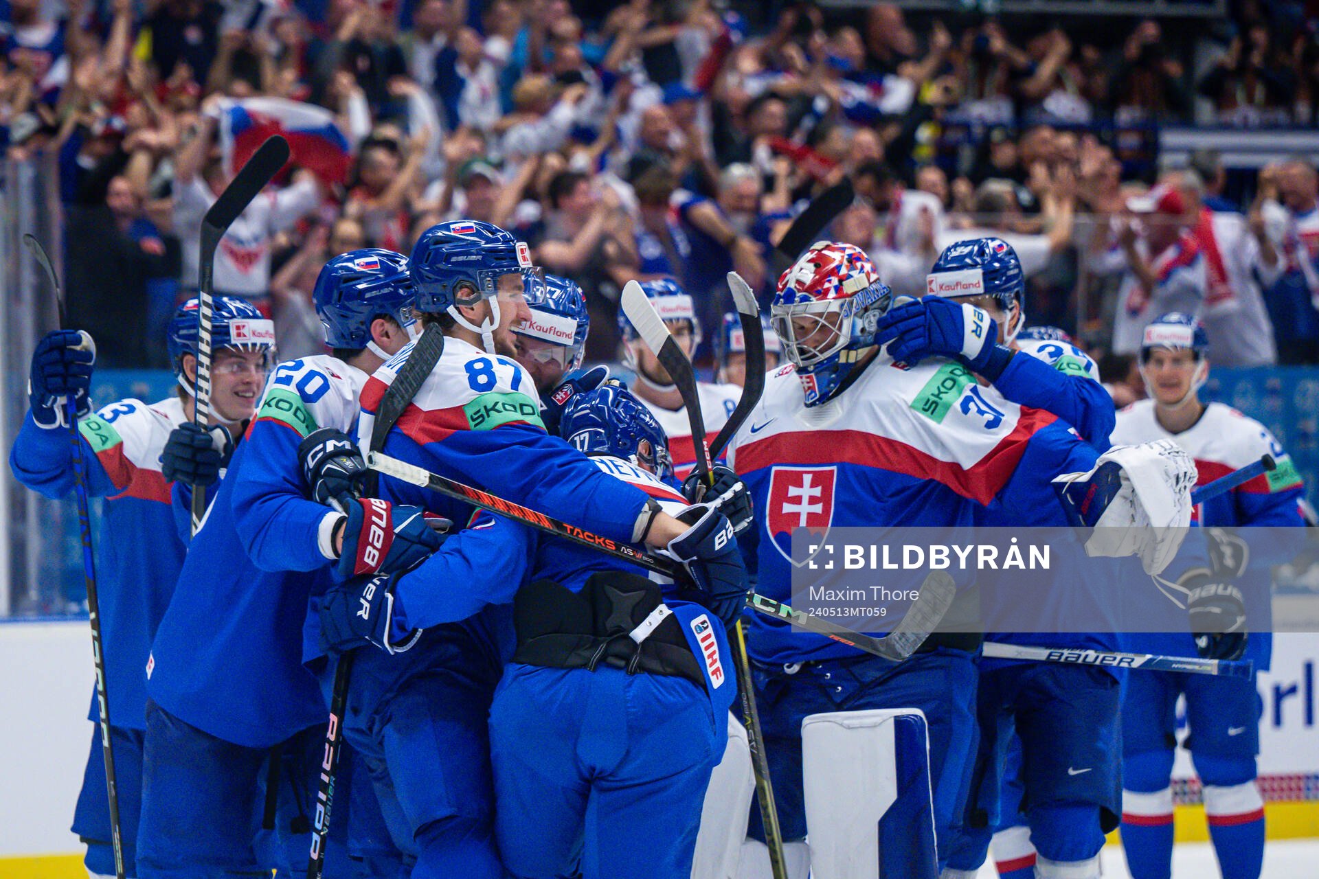 Goaltender Samuel Hlavaj of Slovakia celebrate with teammate