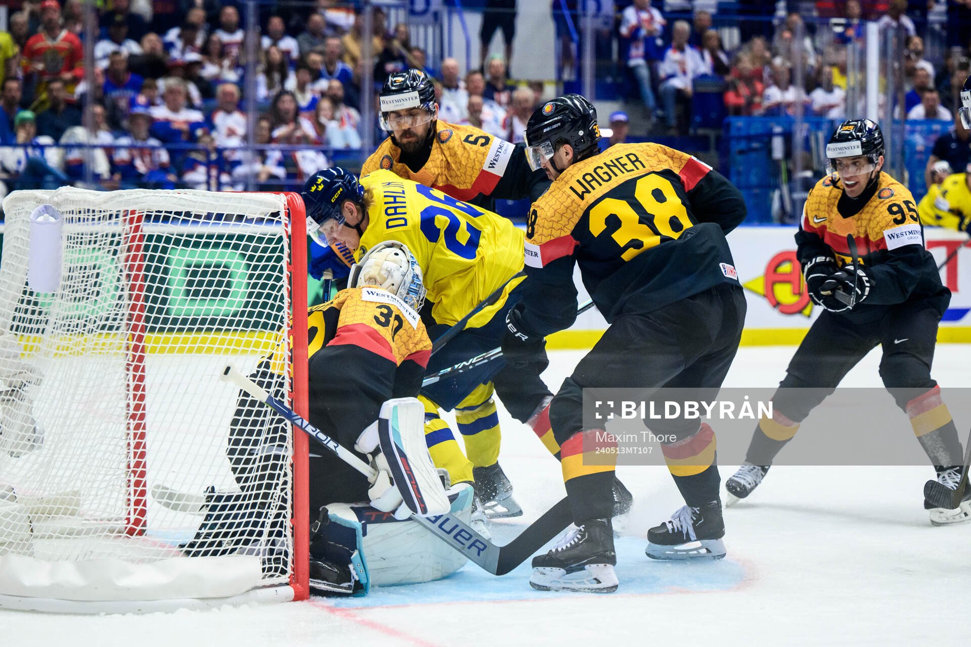Rasmus Dahlin of Sweden and goaltender Philipp Grubauer of