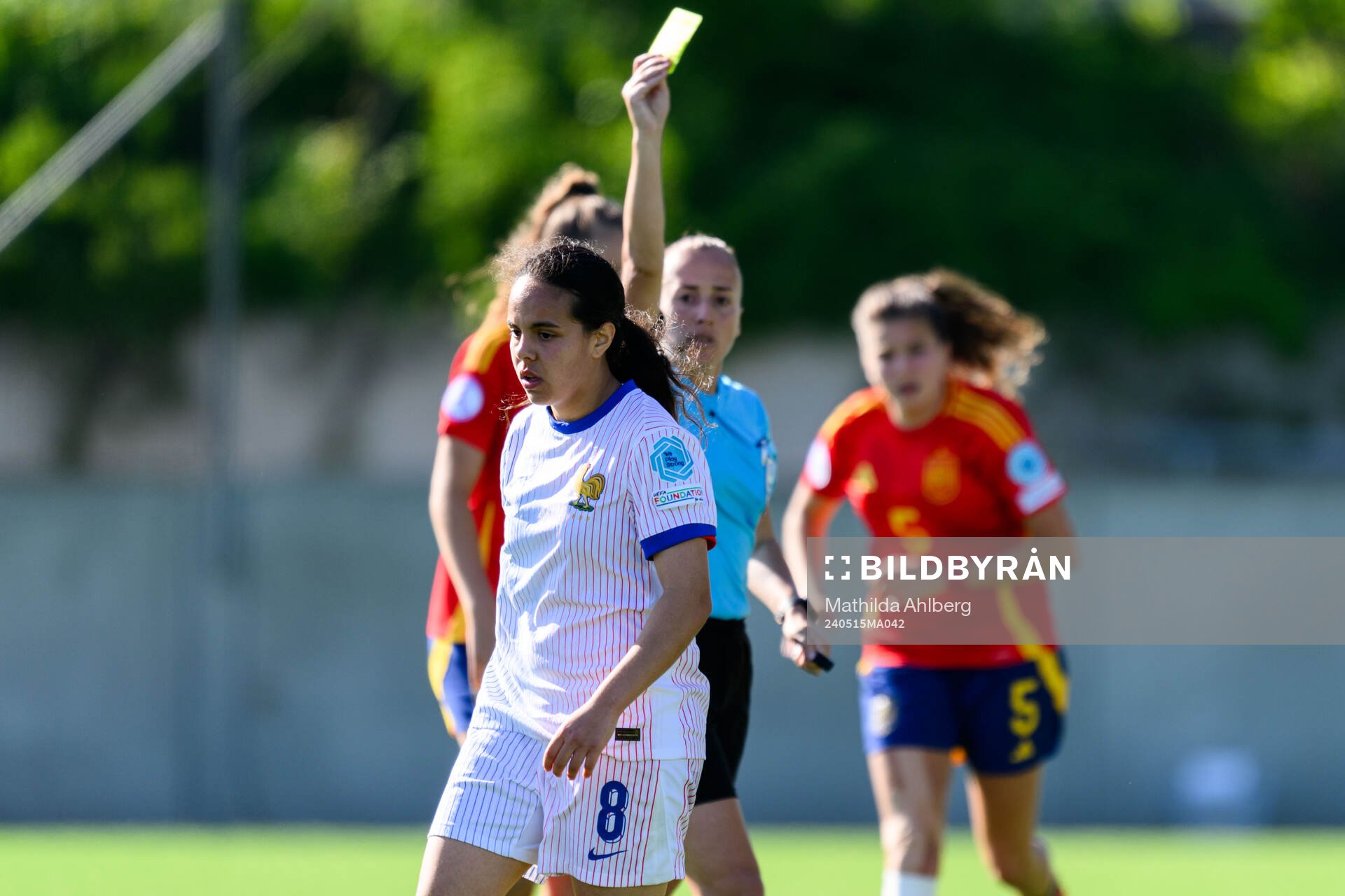 Ambre Ouazar of France receives a yellow card