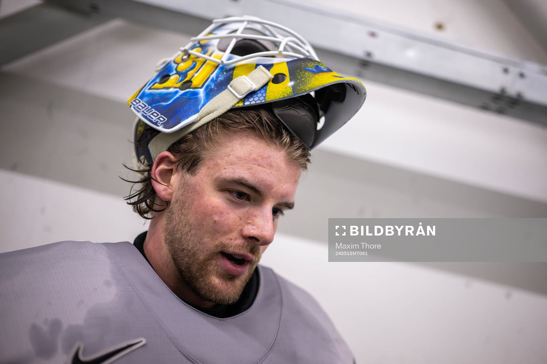 Goaltender Samuel Ersson of Sweden speaks with media