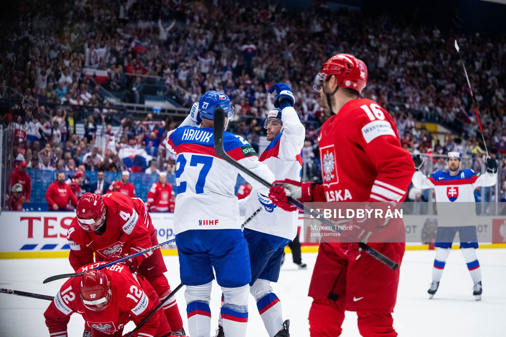 Marek Hrivik of Slovakia celebrates with Peter Cehlarik