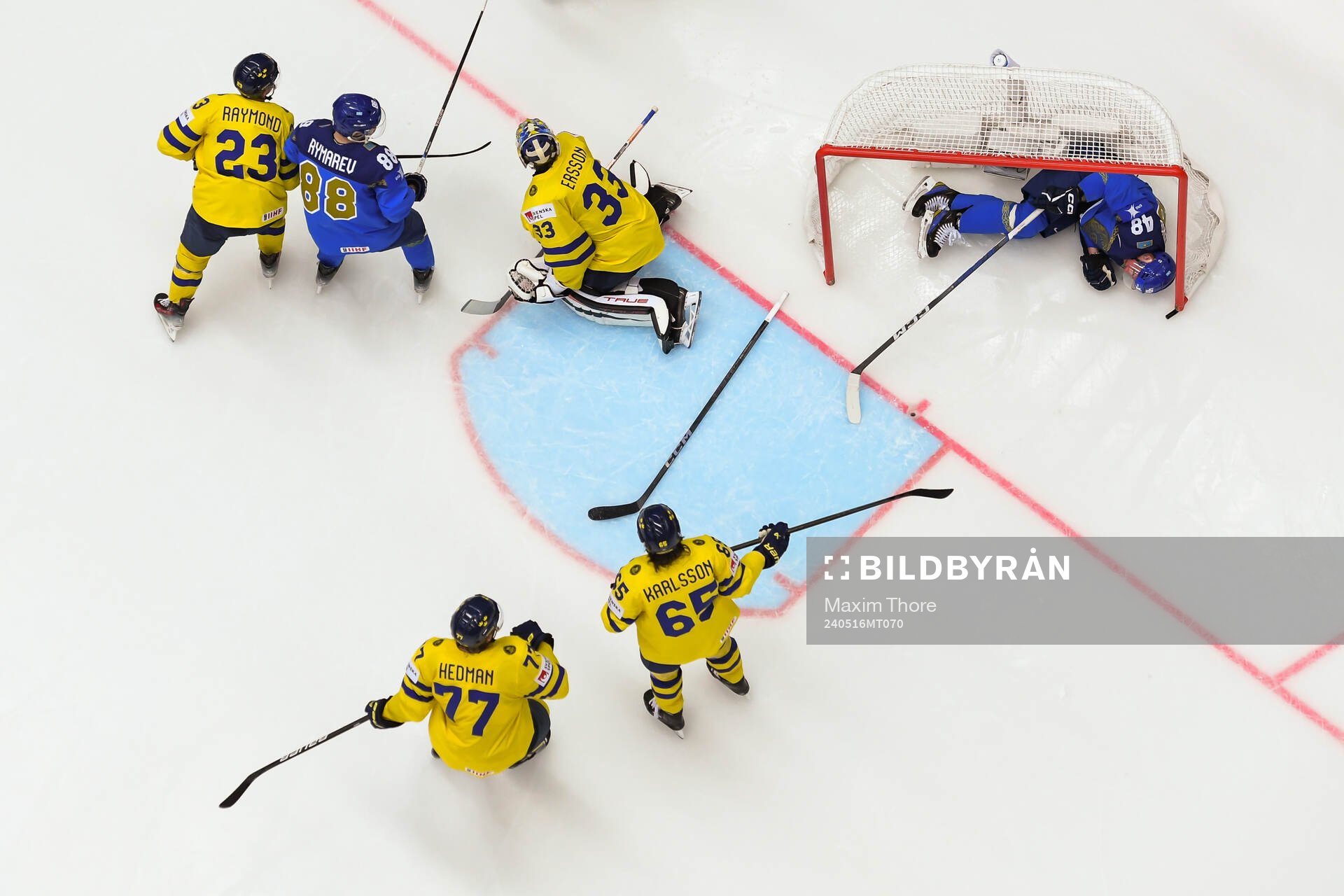 Goaltender Samuel Ersson of Sweden and Roman Starchenko of