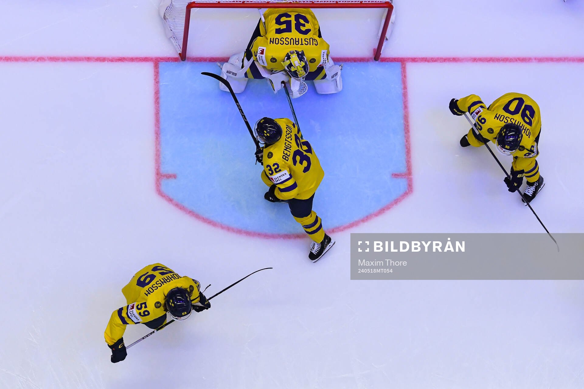 Lukas Bengtsson and goaltender Filip Gustavsson of Sweden
