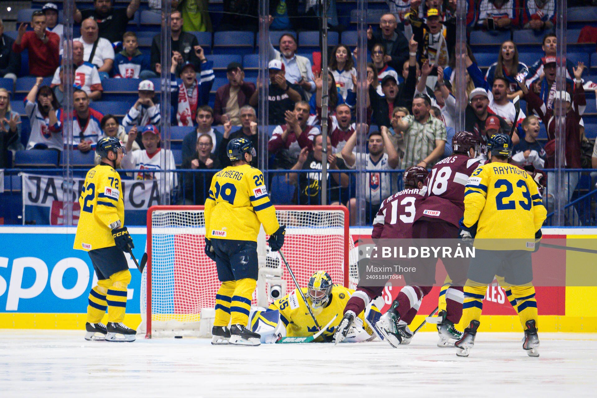 goaltender Filip Gustavsson of Sweden looks dejected