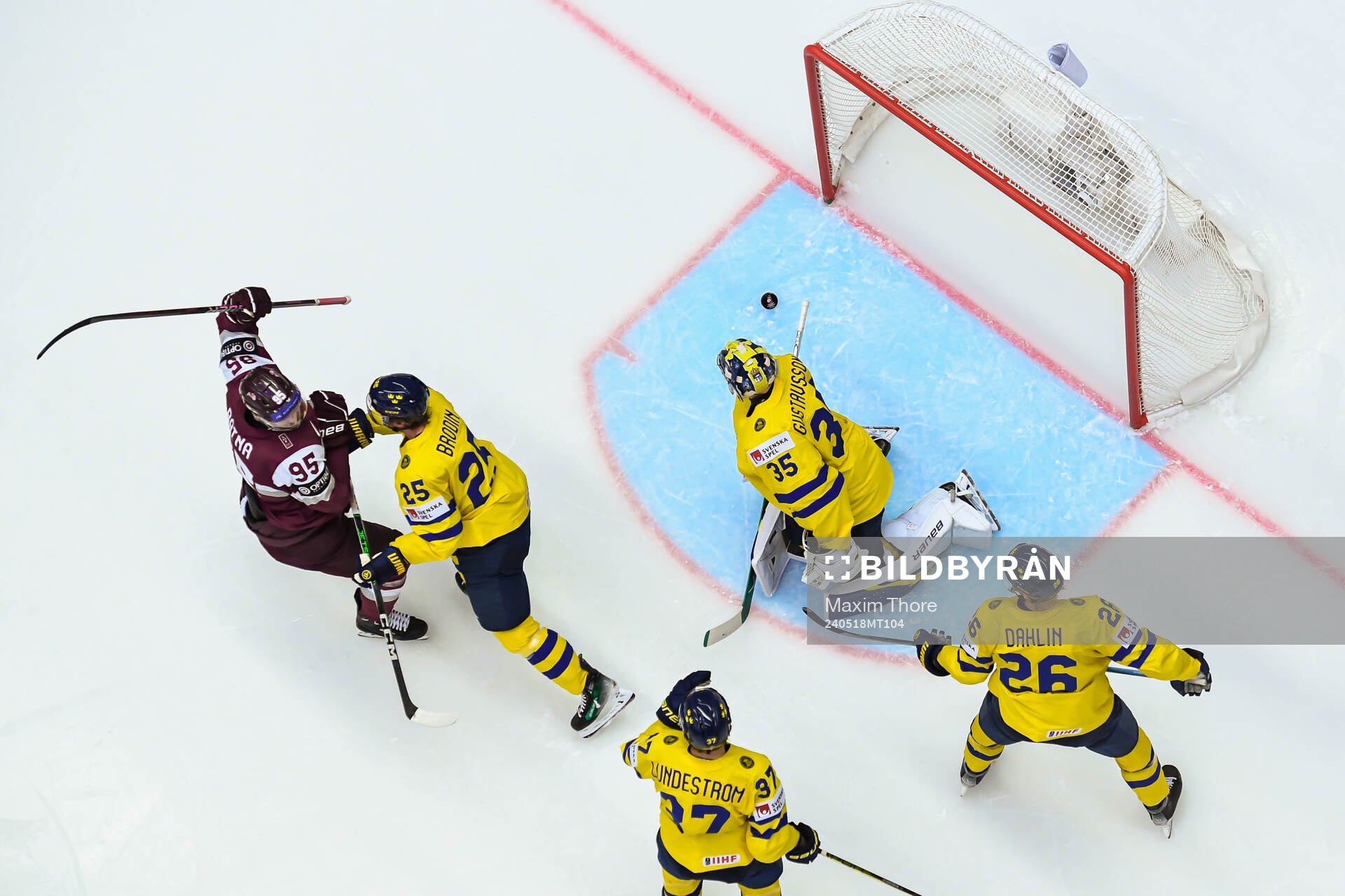 Oskars Batna celebrates the 2-2 goal behind goaltender