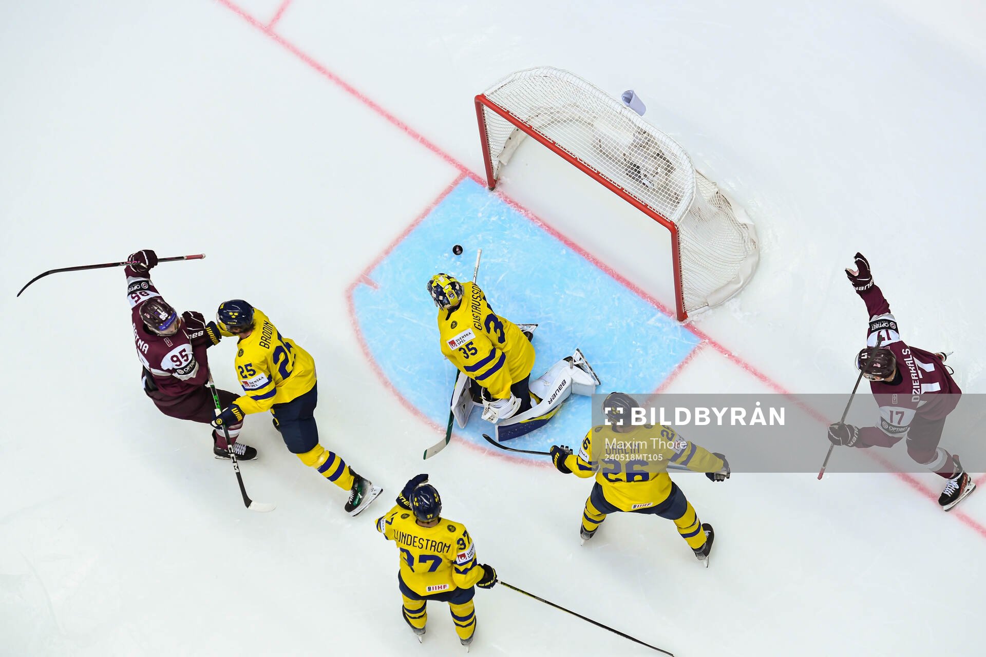 Oskars Batna celebrates the 2-2 goal behind goaltender