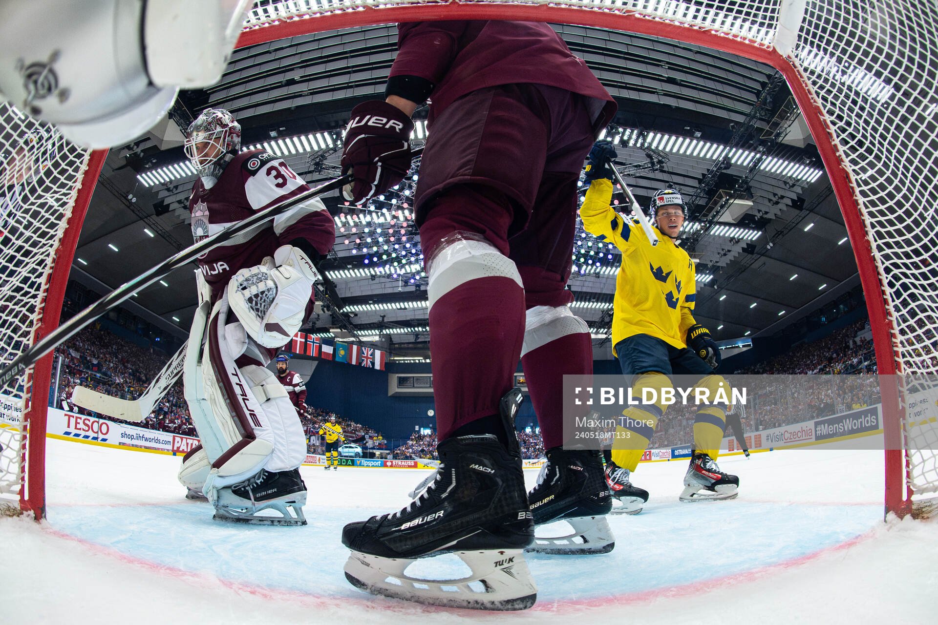 Lucas Raymond of Sweden celebrates a goal behind goaltender