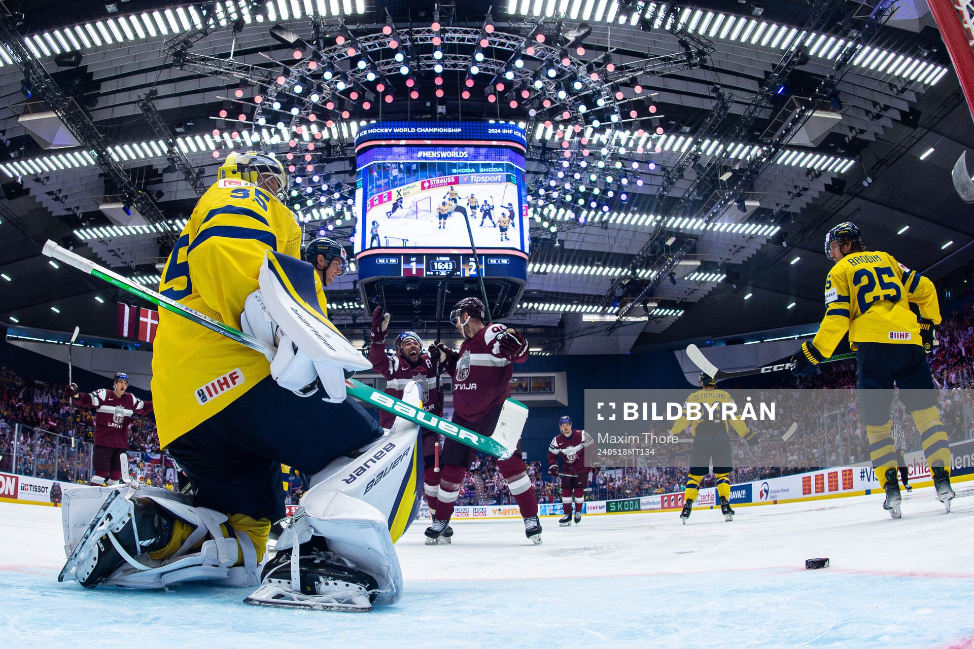Oskars Batna celebrates the 2-2 goal behind goaltender