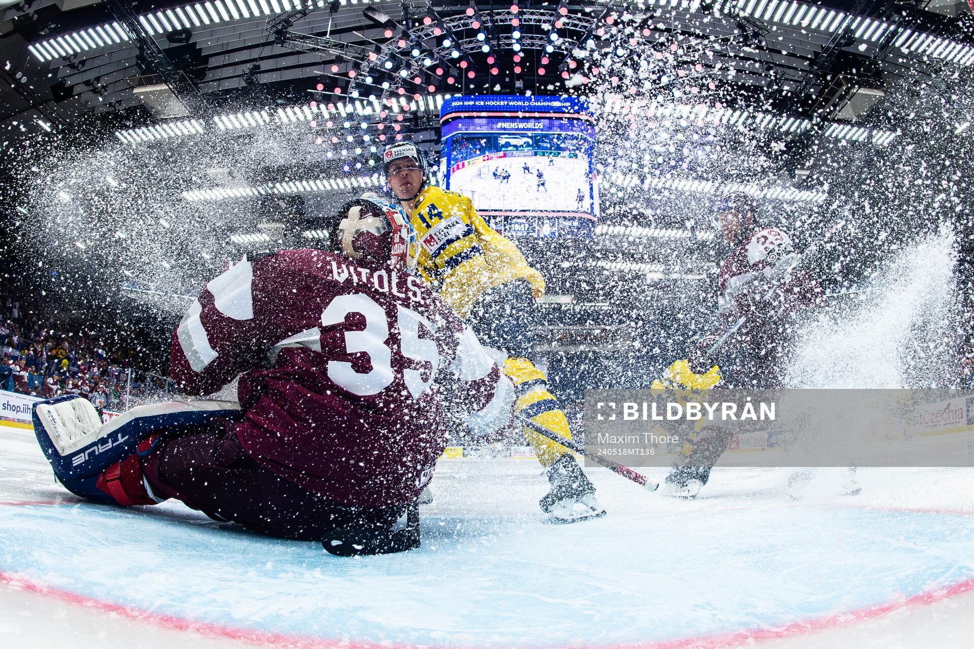 Goaltender Kristers Gudlevskis of Latvia and Joel Eriksson